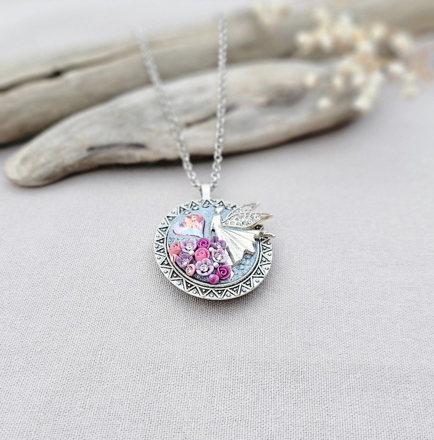 lavender fairy pendant, soft pink locket, fairy jewelry, silver chain necklace, photo locket, aromatic locket, handcrafted flowers, unique gift, whimsical charm, magical necklace, elegant jewelry, fairy tale locket, polymer clay pendant