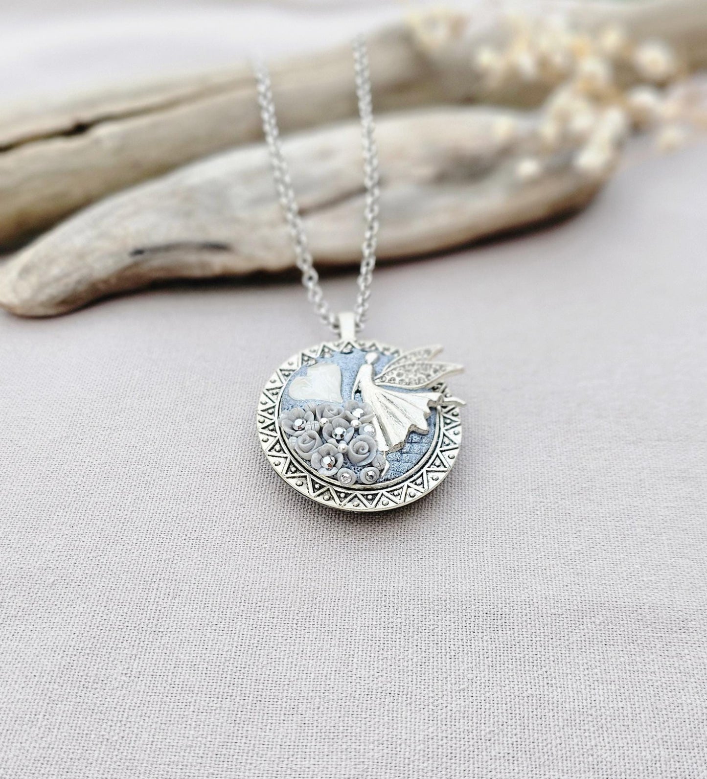 white fairy pendant, classic locket, elegant necklace, floral jewelry, fairy tale charm, personal locket, keepsake jewelry, romantic gift, unique locket, silver chain necklace, handcrafted pendant, mystical charm, serene jewelry