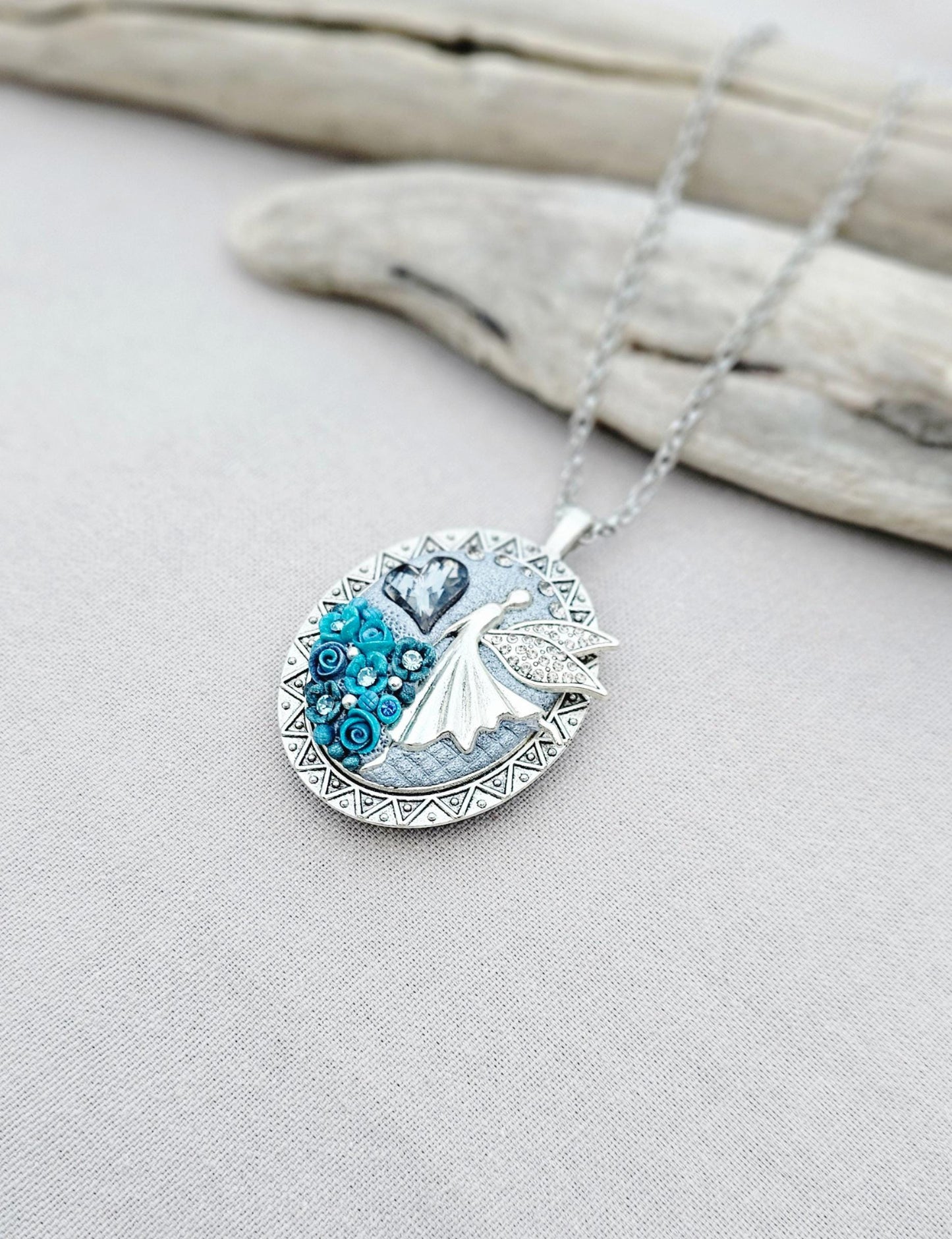 turquoise flower pendant, black crystal charm, fairy locket, silver fairy necklace, unique gift, magical jewelry, photo locket, handcrafted pendant, vibrant floral, elegant accessory, mystical charm, long chain necklace, whimsical locket