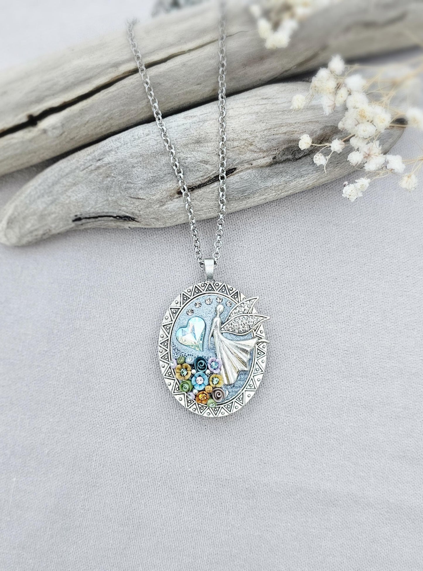 multicolor floral pendant, fairy locket, vibrant jewelry, colorful necklace, keepsake locket, photo pendant, handcrafted fairy, enchanting accessory, unique gift, magical charm, floral fairy necklace, whimsical jewelry, silver chain pendant