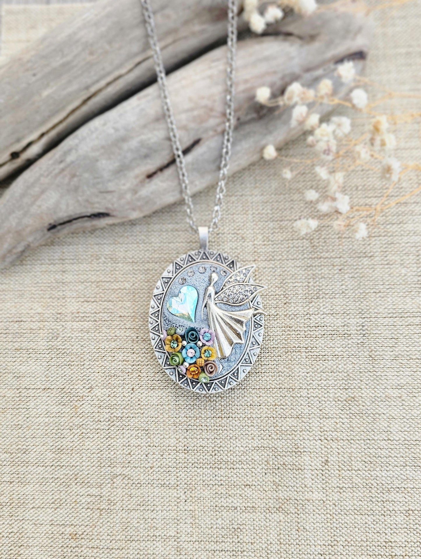 multicolor floral pendant, fairy locket, vibrant jewelry, colorful necklace, keepsake locket, photo pendant, handcrafted fairy, enchanting accessory, unique gift, magical charm, floral fairy necklace, whimsical jewelry, silver chain pendant