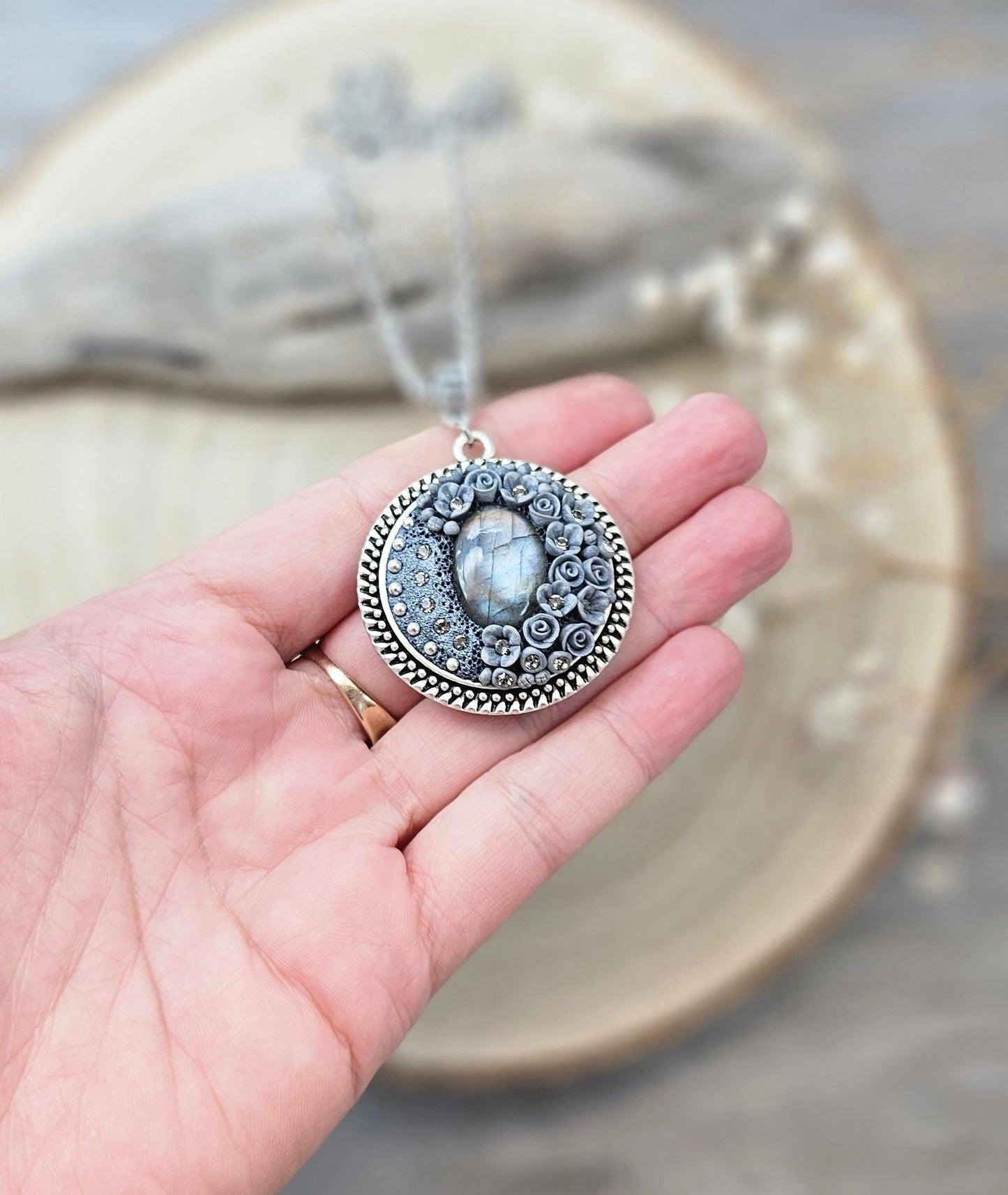 wonderful talisman, amulet. Handmade pendant with labradorite. Jewelry for a photo. Jewelry for essential oil. Blue Labradorite. Dark blue flowers made of polymer clay