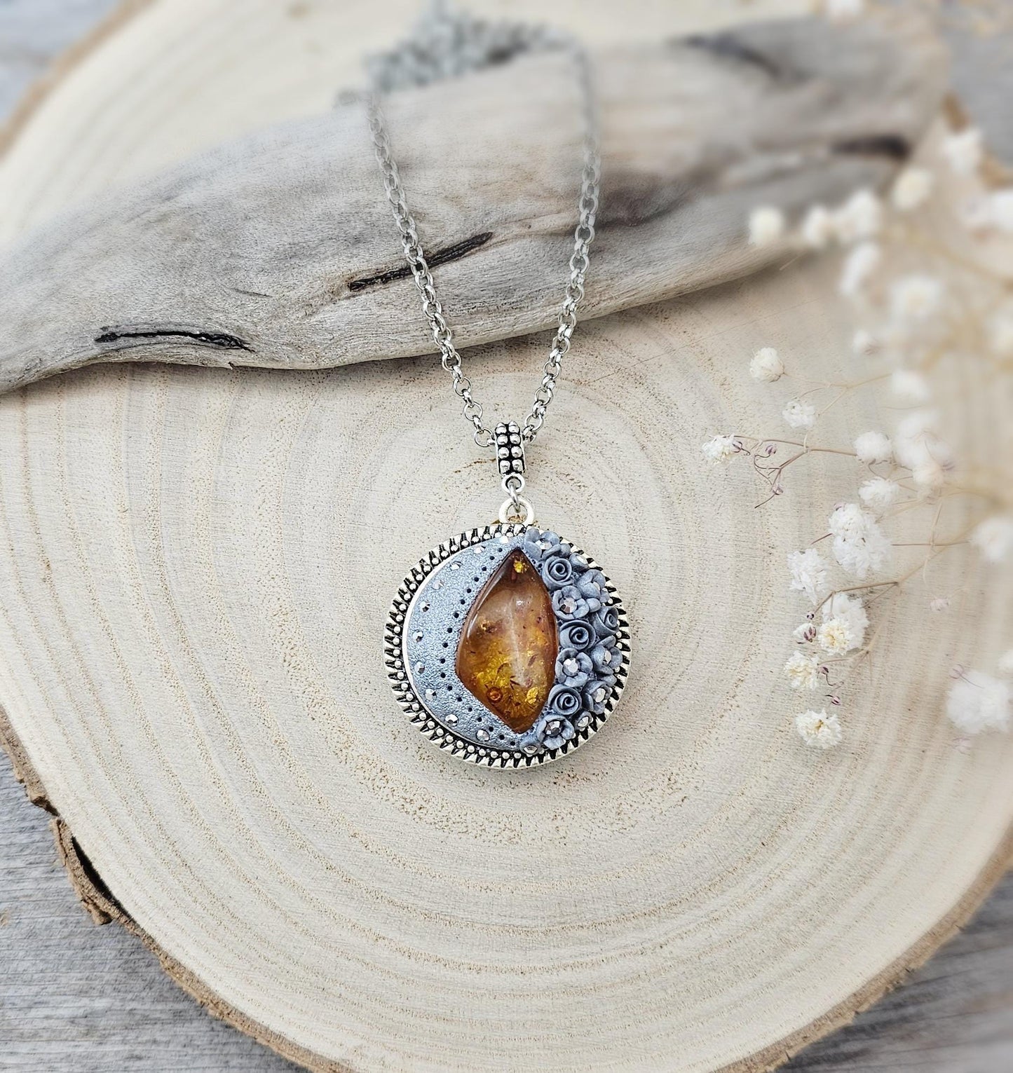 wonderful talisman, amulet. Handmade pendant with amber. Jewelry for a photo. Jewelry for essential oil. Baltic amber. Flowers from polymer clay