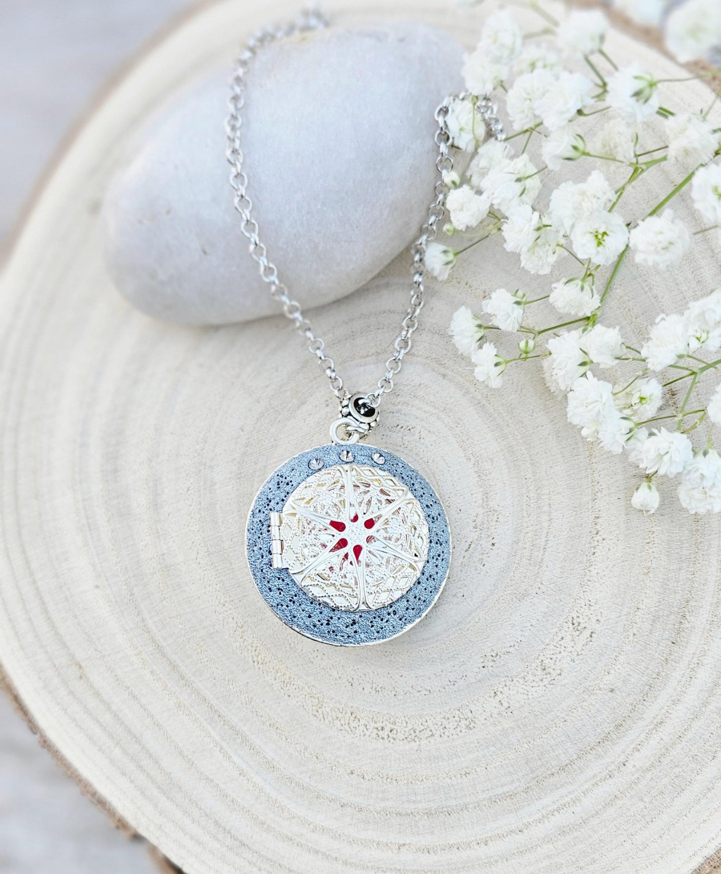 Pendant locket with amber, handmade flowers from polymer clay. On the other side, there is a locket with a heart that opens, inside which you can put a photo or a scent. A great gift for a loved one, or for yourself as a protective amulet.
