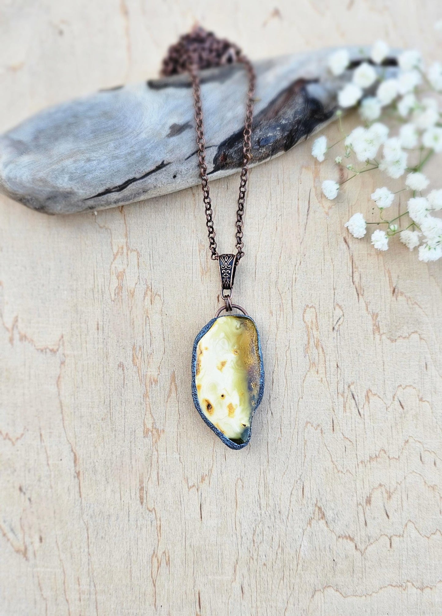 pendant with large amber, mounted in polymer clay, Copper-colored chain