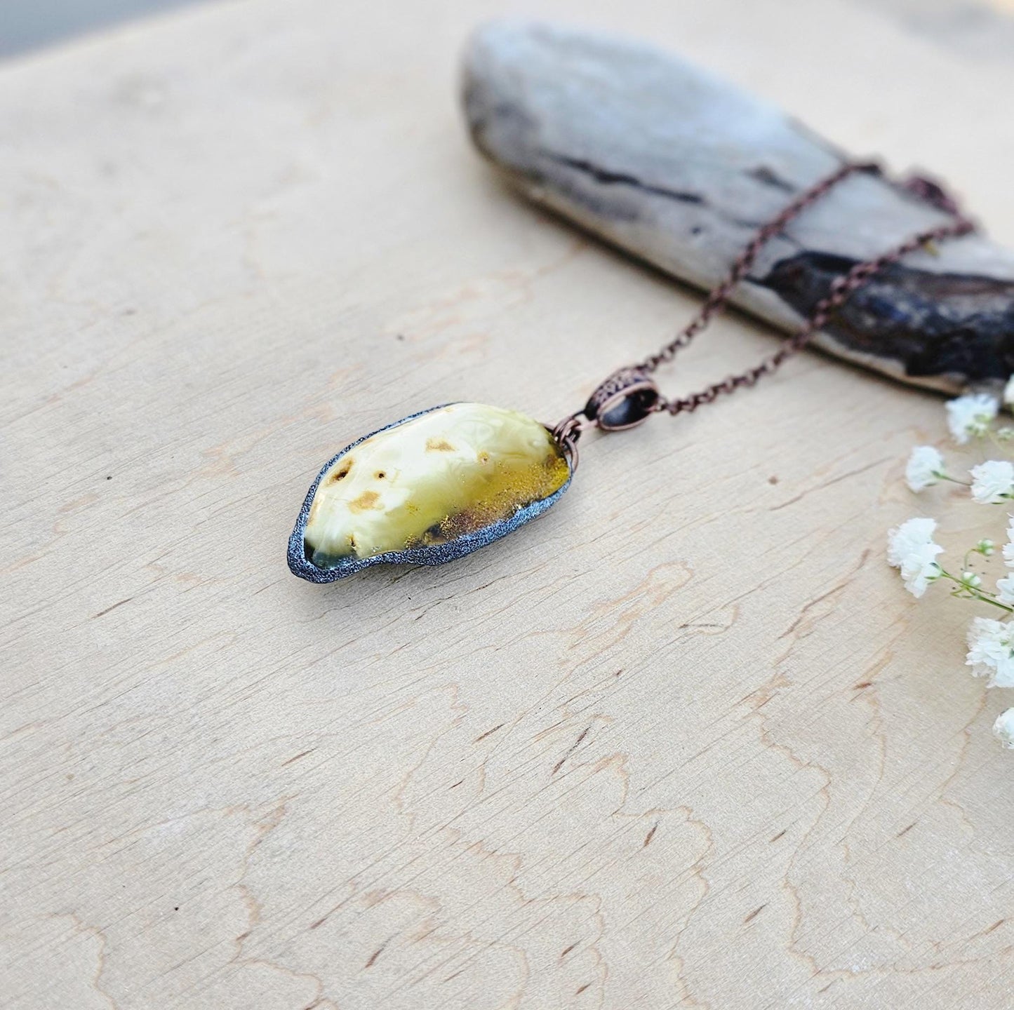 pendant with large amber, mounted in polymer clay, Copper-colored chain