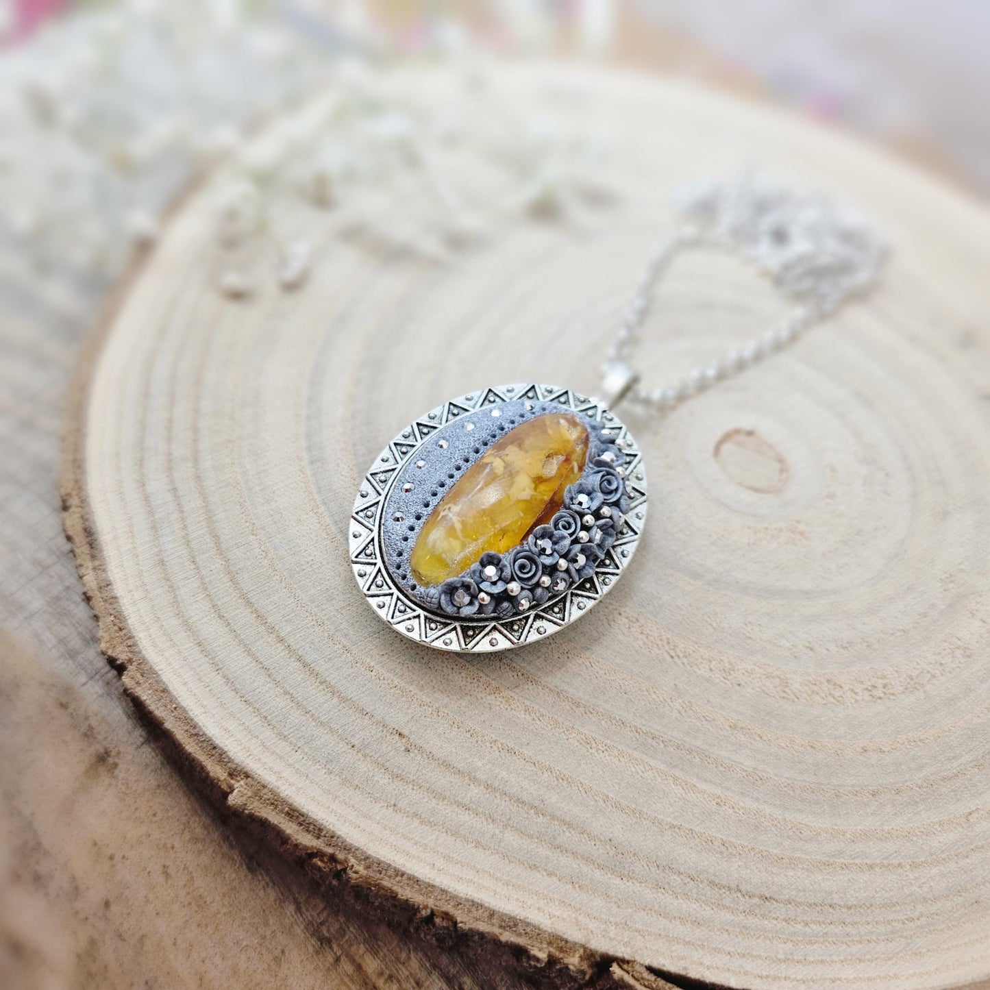 Double-sided Pendant locket with baltic amber and polymer clay flowers