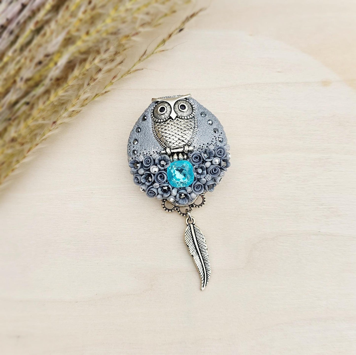 handmade polymer clay brooch with owl and handmade flowers and crystal