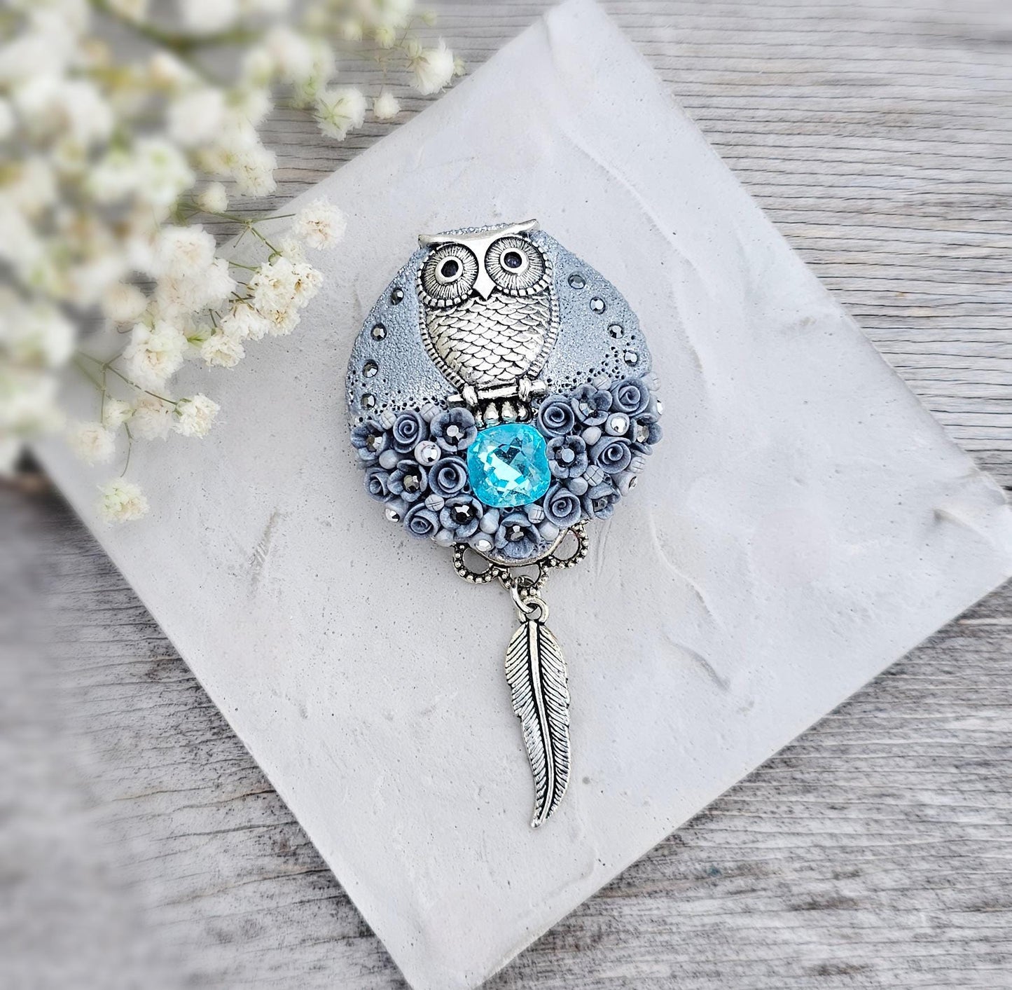 handmade polymer clay brooch with owl and handmade flowers and crystal