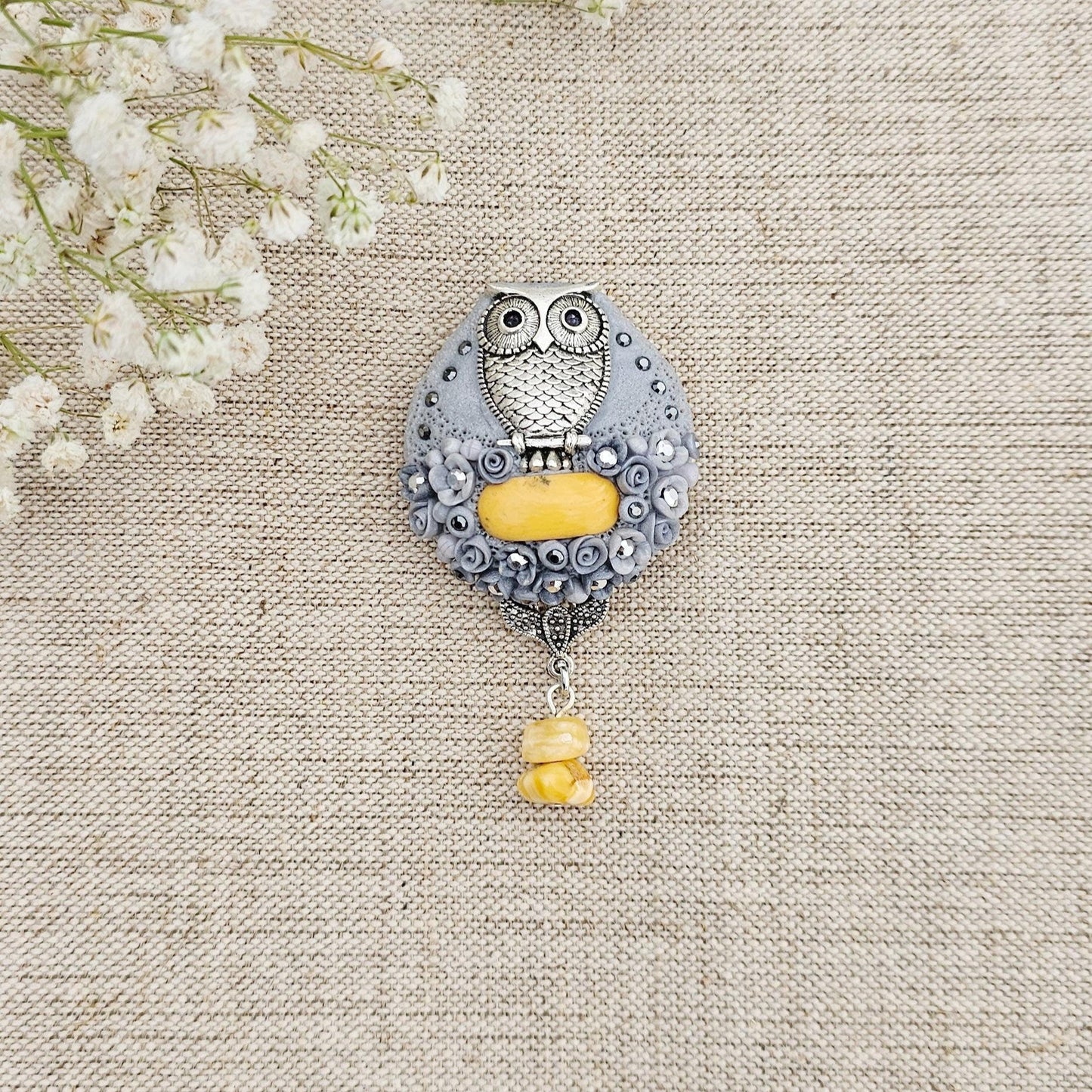 handmade polymer clay brooch with owl and handmade flowers and baltic amber