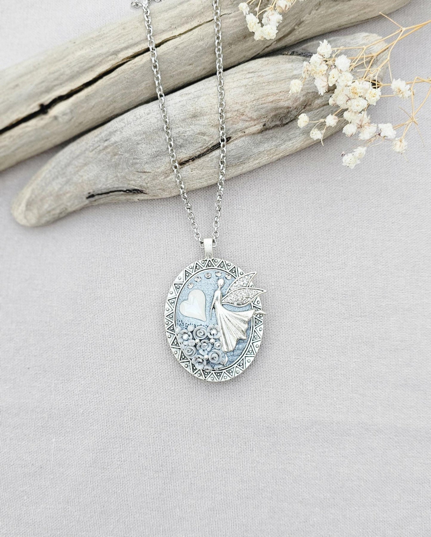 white fairy pendant, classic locket, elegant necklace, floral jewelry, fairy tale charm, personal locket, keepsake jewelry, romantic gift, unique locket, silver chain necklace, handcrafted pendant, mystical charm, serene jewelry