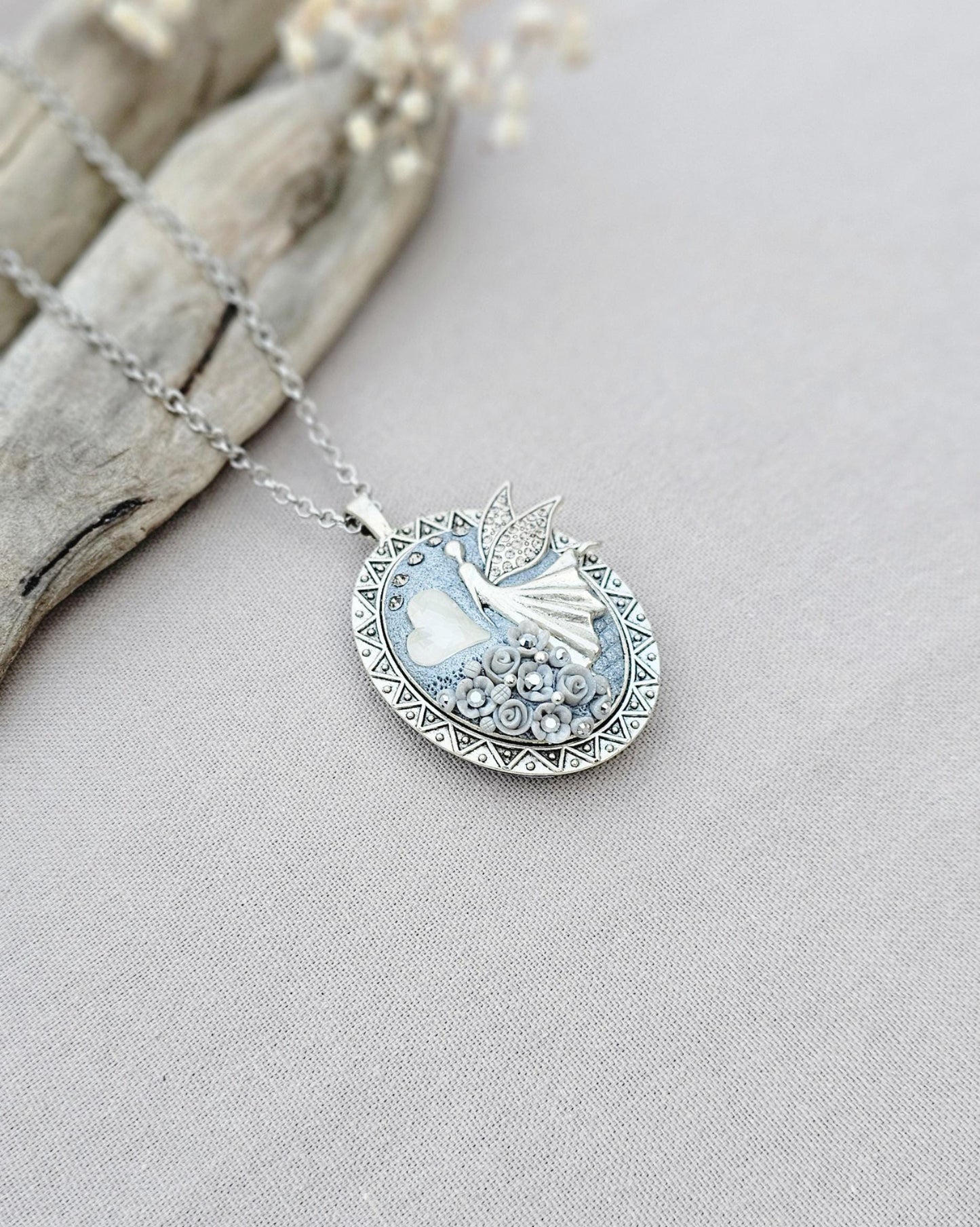 white fairy pendant, classic locket, elegant necklace, floral jewelry, fairy tale charm, personal locket, keepsake jewelry, romantic gift, unique locket, silver chain necklace, handcrafted pendant, mystical charm, serene jewelry