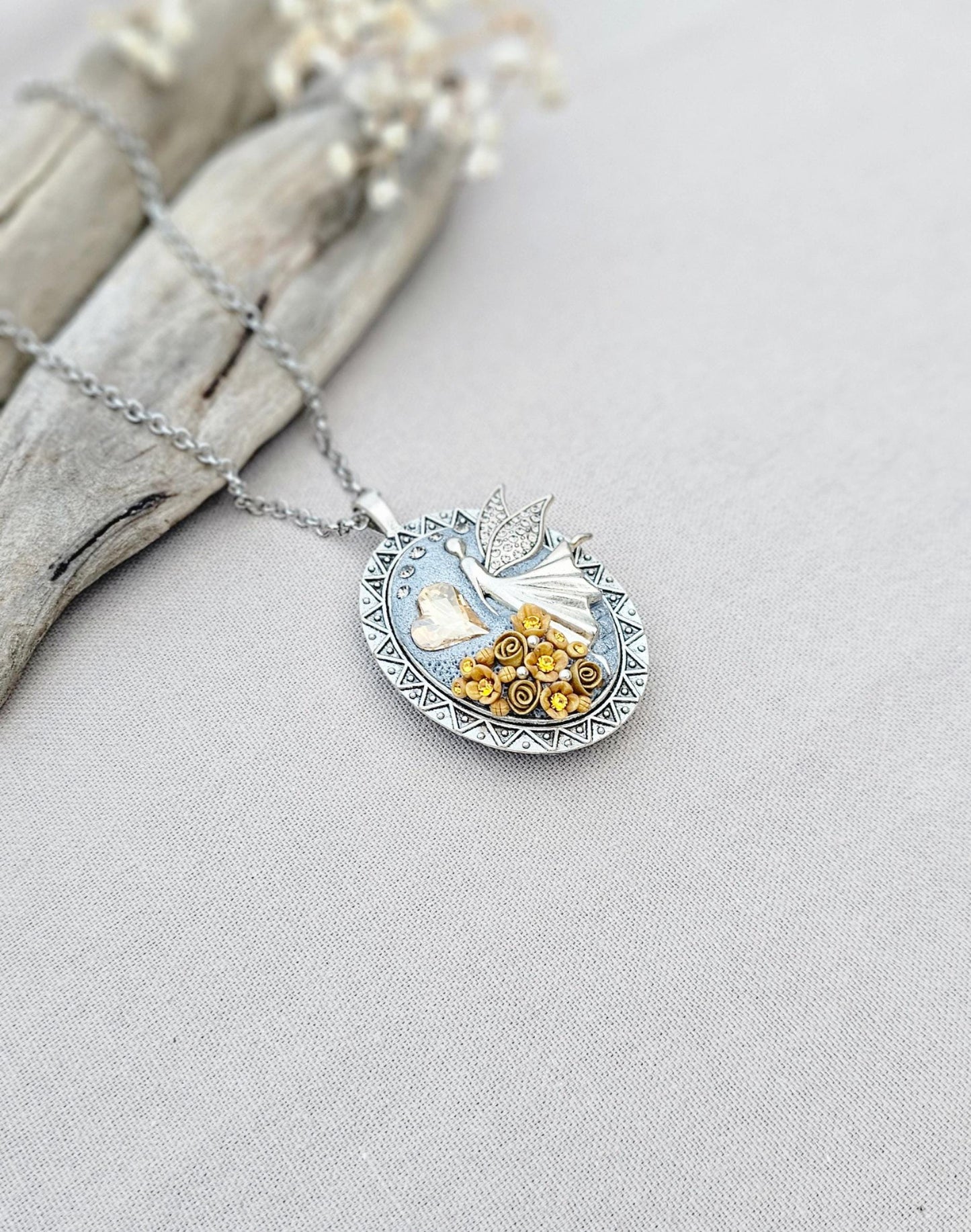 soft gold pendant, fairy locket, floral jewelry, crystal heart necklace, handcrafted pendant, whimsical charm, fairy tale jewelry, unique locket, keepsake necklace, elegant accessory, photo locket, artisan necklace, silver chain pendant