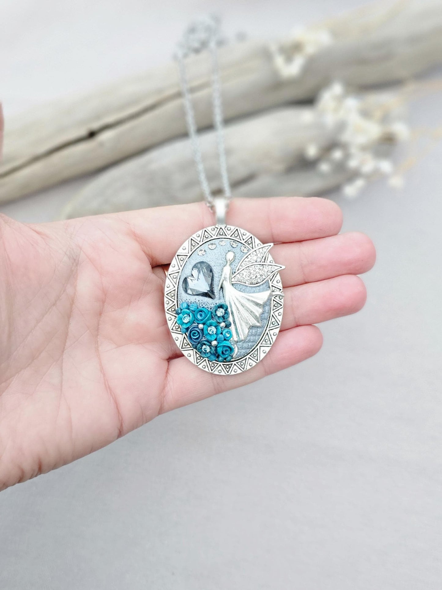 turquoise flower pendant, black crystal charm, fairy locket, silver fairy necklace, unique gift, magical jewelry, photo locket, handcrafted pendant, vibrant floral, elegant accessory, mystical charm, long chain necklace, whimsical locket