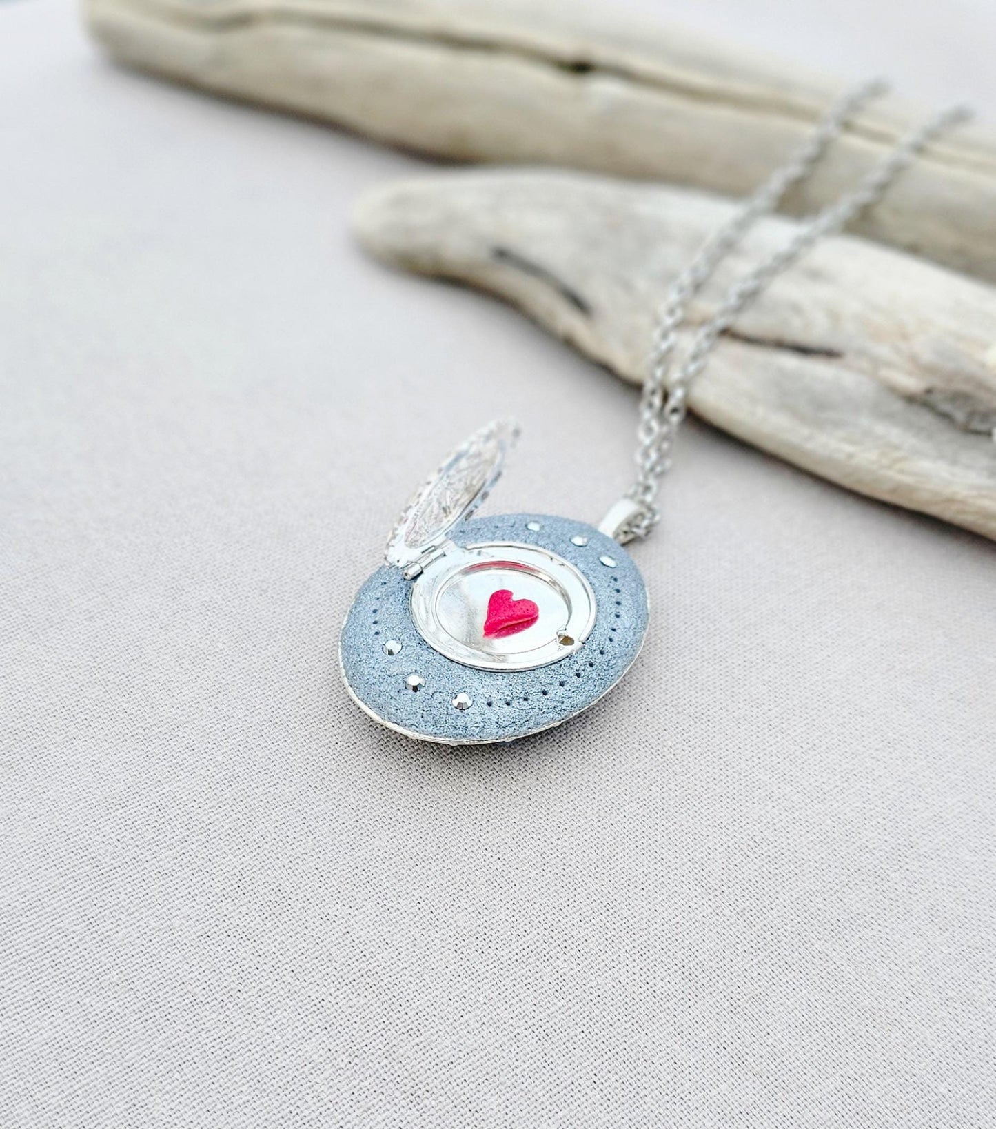 turquoise flower pendant, black crystal charm, fairy locket, silver fairy necklace, unique gift, magical jewelry, photo locket, handcrafted pendant, vibrant floral, elegant accessory, mystical charm, long chain necklace, whimsical locket