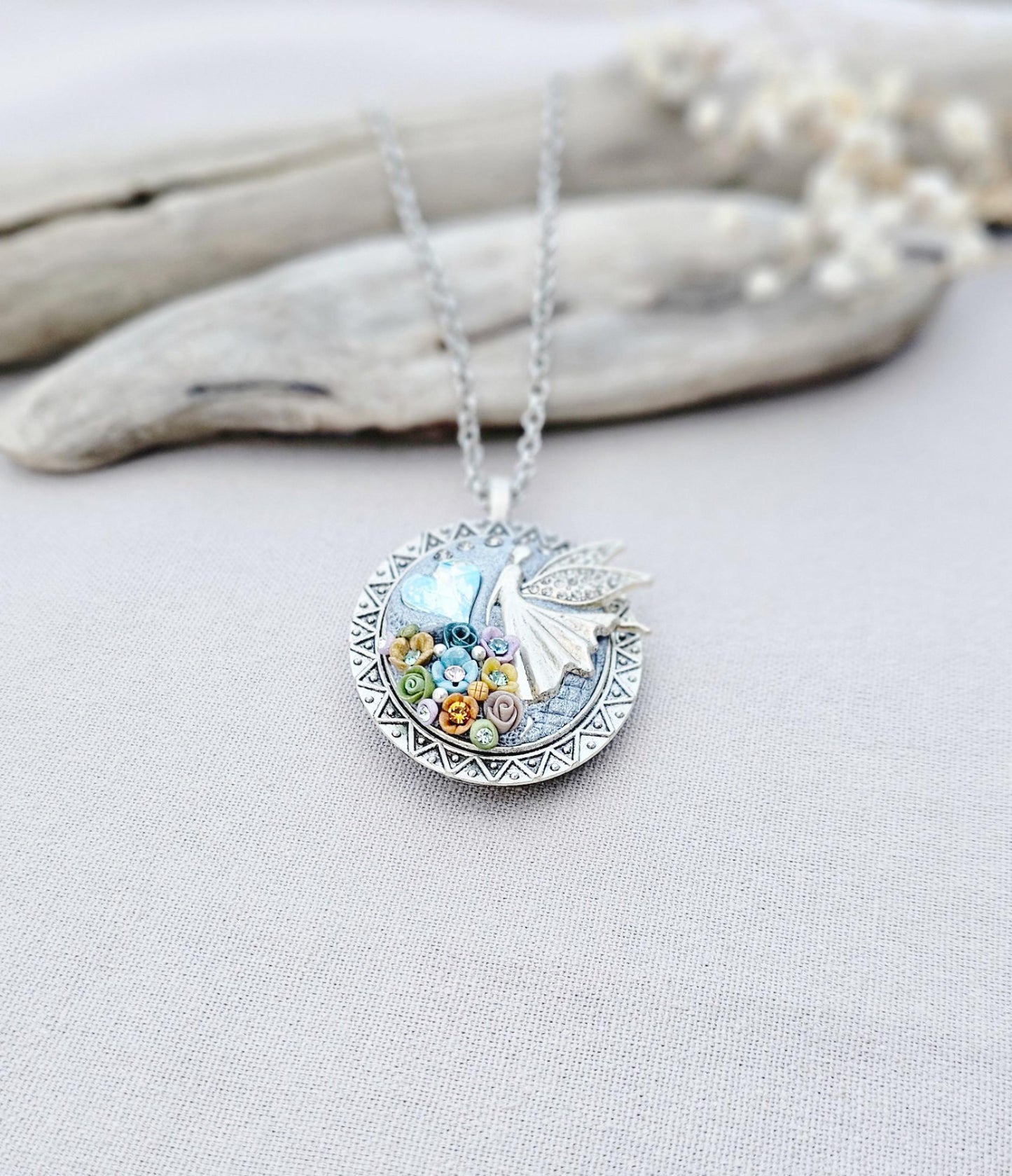 multicolor floral pendant, fairy locket, vibrant jewelry, colorful necklace, keepsake locket, photo pendant, handcrafted fairy, enchanting accessory, unique gift, magical charm, floral fairy necklace, whimsical jewelry, silver chain pendant