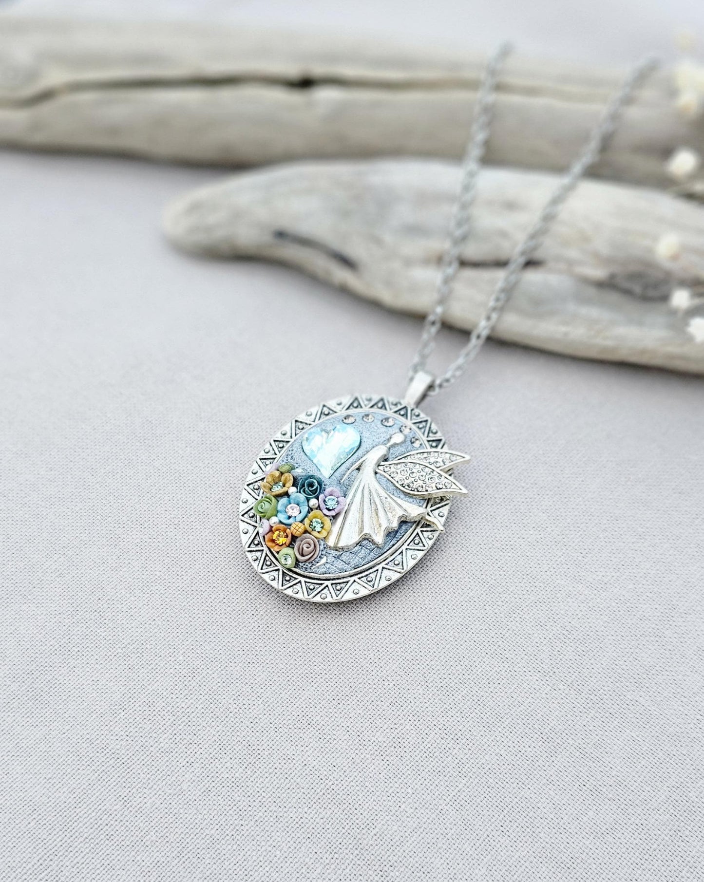 multicolor floral pendant, fairy locket, vibrant jewelry, colorful necklace, keepsake locket, photo pendant, handcrafted fairy, enchanting accessory, unique gift, magical charm, floral fairy necklace, whimsical jewelry, silver chain pendant
