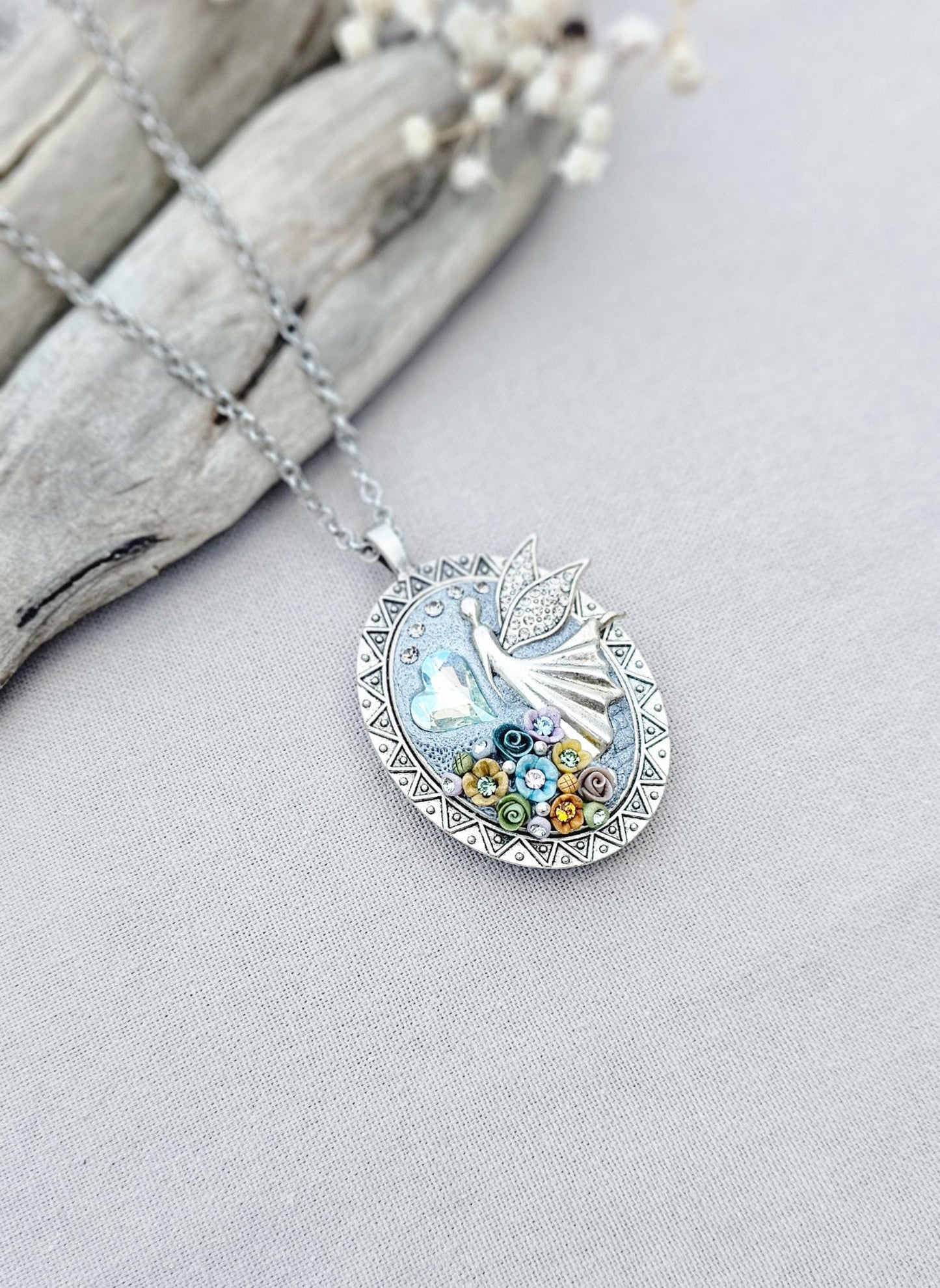 multicolor floral pendant, fairy locket, vibrant jewelry, colorful necklace, keepsake locket, photo pendant, handcrafted fairy, enchanting accessory, unique gift, magical charm, floral fairy necklace, whimsical jewelry, silver chain pendant