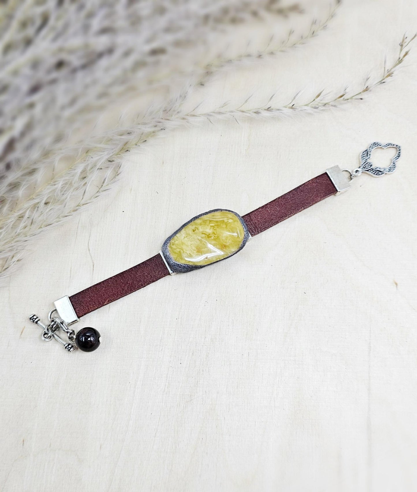 Handmade bracelet with chunky light yellow baltic amber and brown leather strap.