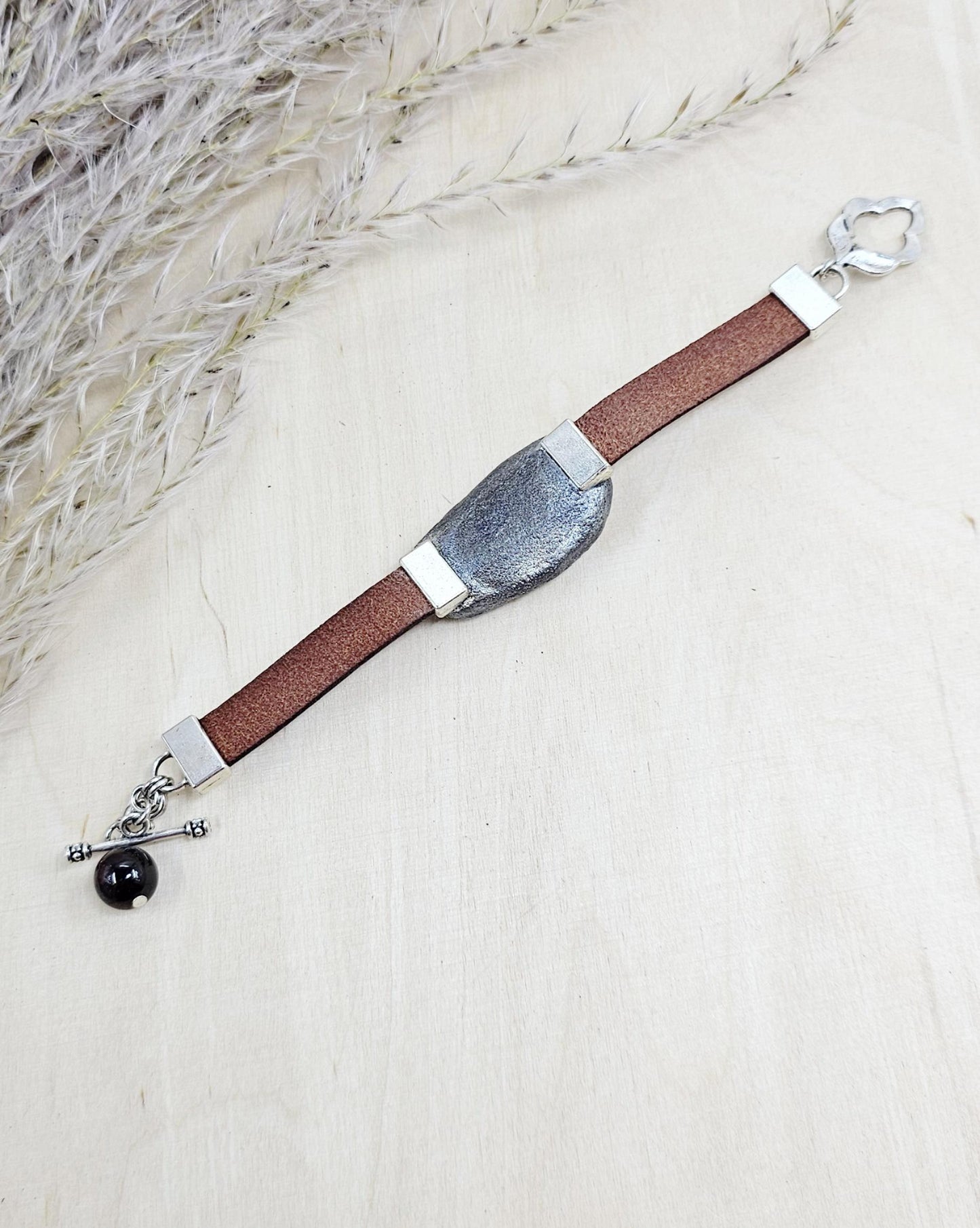 Handmade bracelet with chunky light yellow baltic amber and brown leather strap.