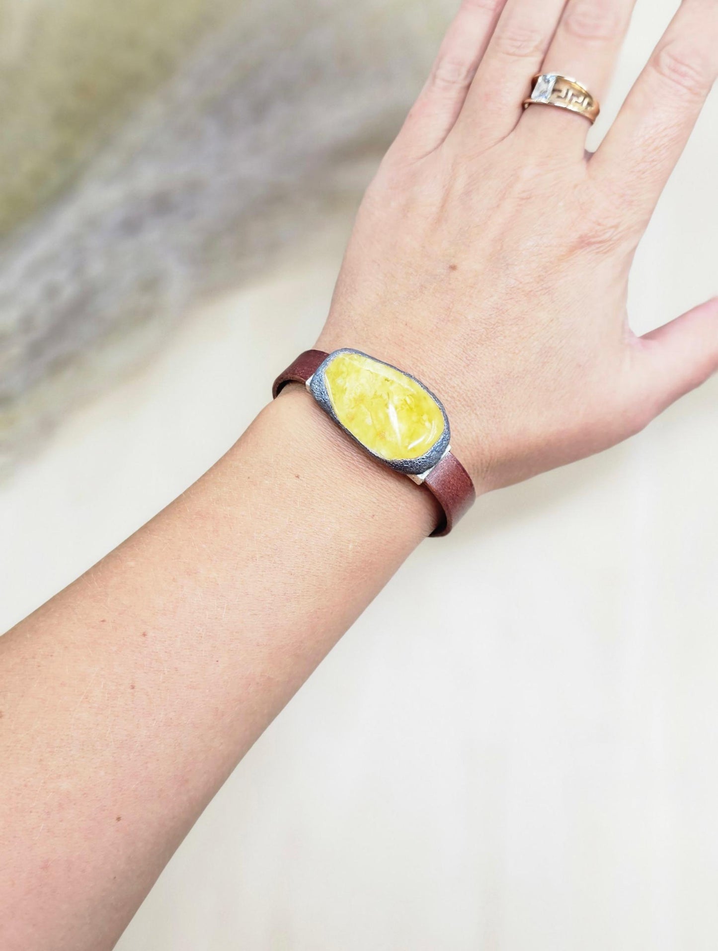 Handmade bracelet with chunky light yellow baltic amber and brown leather strap.