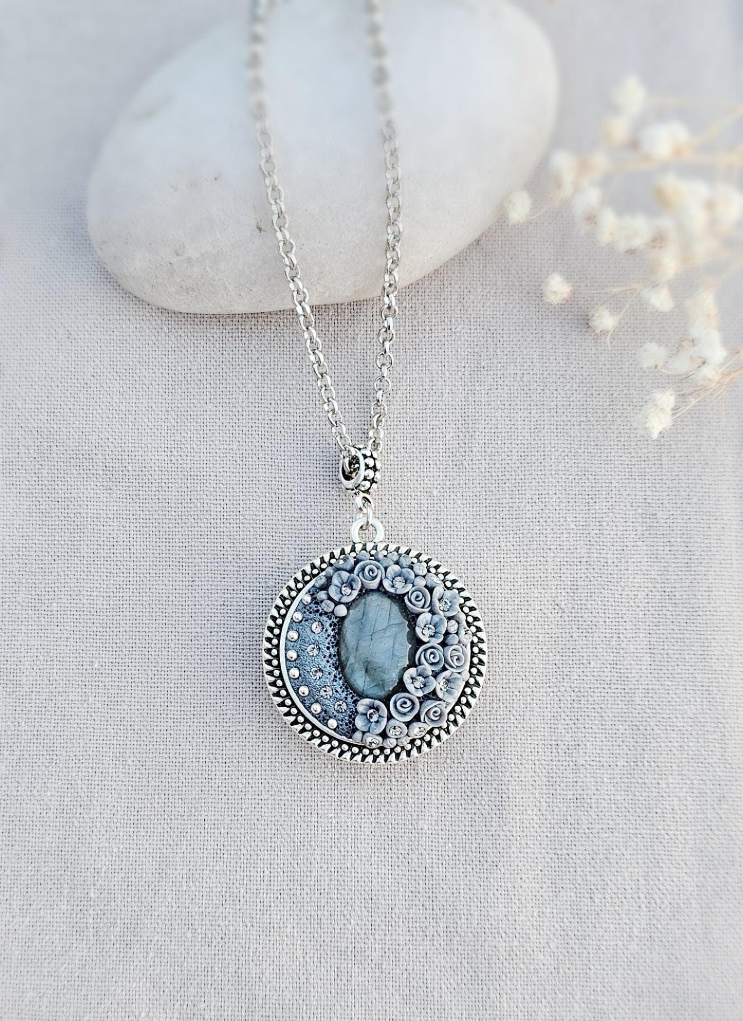 wonderful talisman, amulet. Handmade pendant with labradorite. Jewelry for a photo. Jewelry for essential oil. Blue Labradorite. Dark blue flowers made of polymer clay
