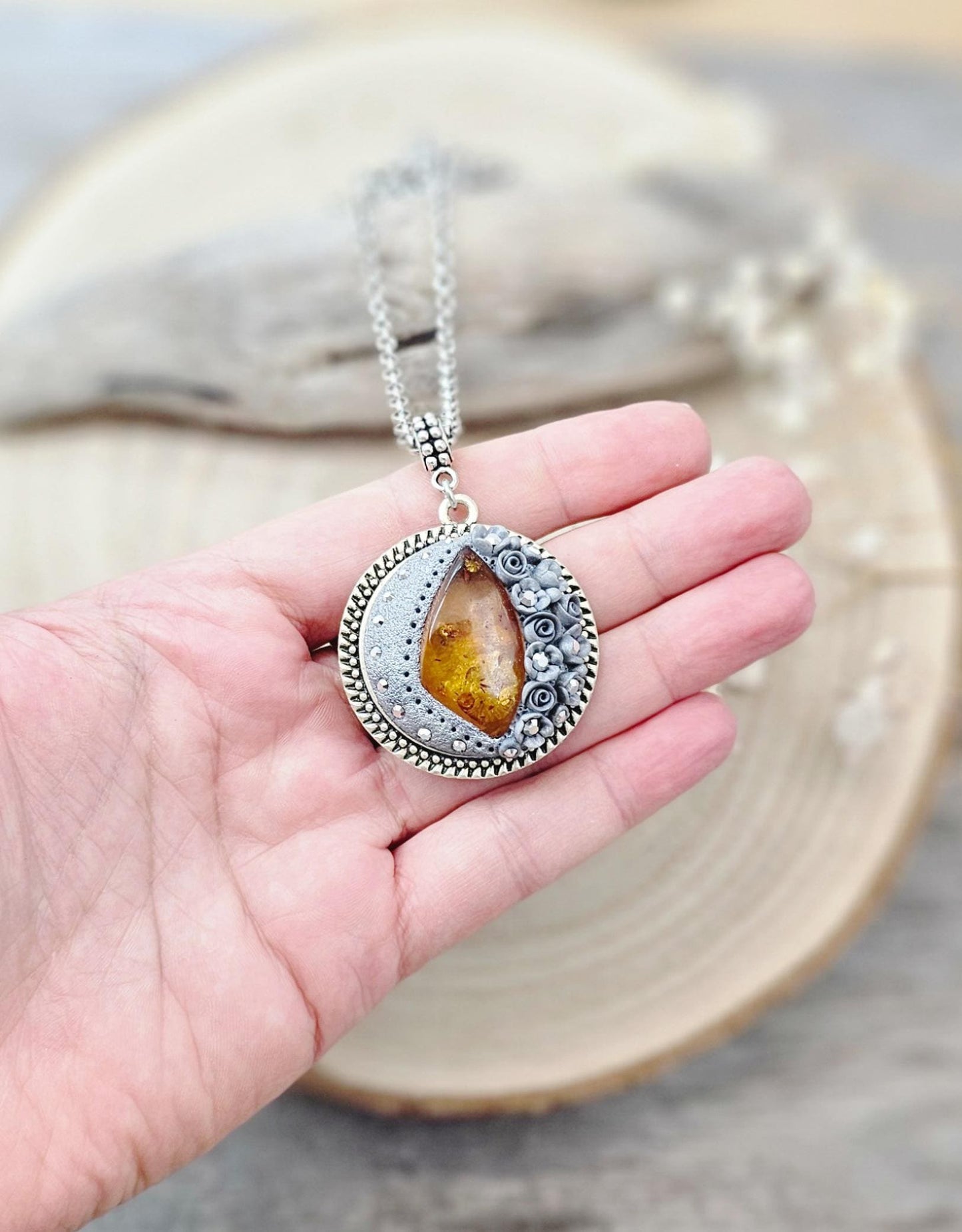 wonderful talisman, amulet. Handmade pendant with amber. Jewelry for a photo. Jewelry for essential oil. Baltic amber. Flowers from polymer clay