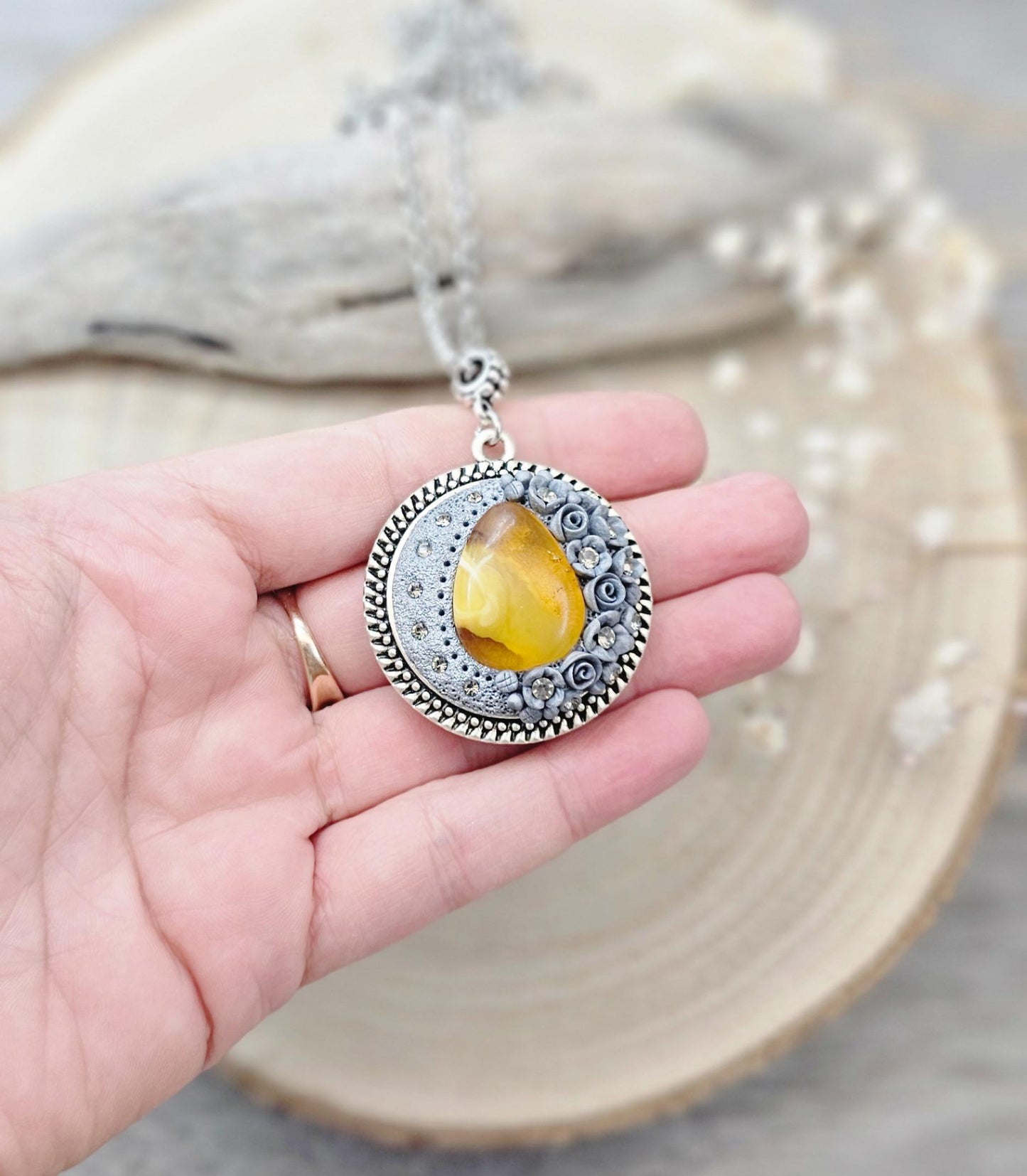 wonderful talisman, amulet. Handmade pendant with amber. Jewelry for a photo. Jewelry for essential oil. Baltic amber. Flowers from polymer clay