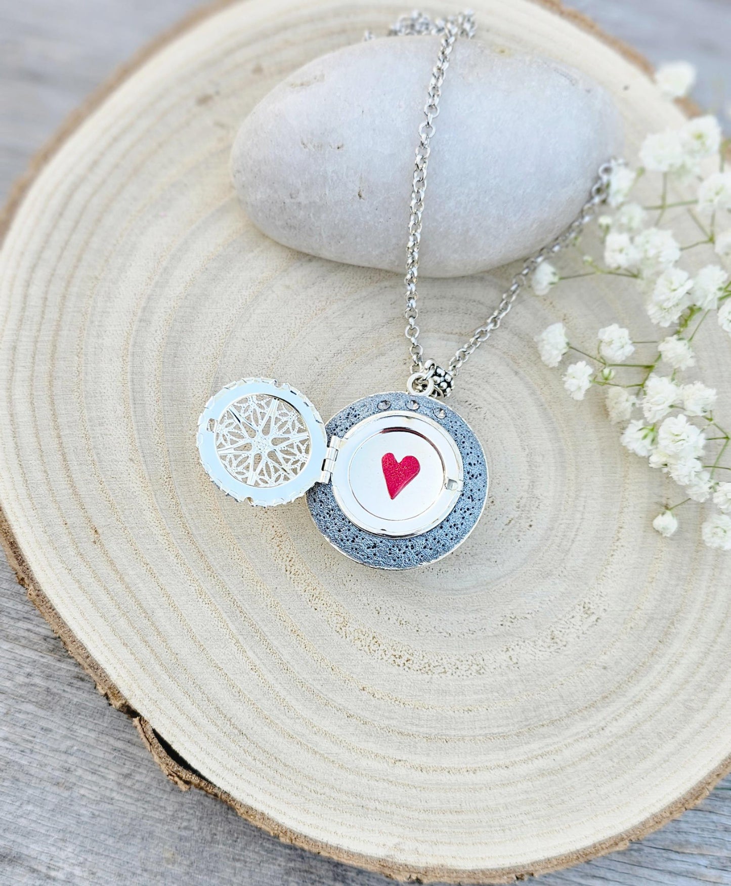 Pendant locket with amber, handmade flowers from polymer clay. On the other side, there is a locket with a heart that opens, inside which you can put a photo or a scent. A great gift for a loved one, or for yourself as a protective amulet.