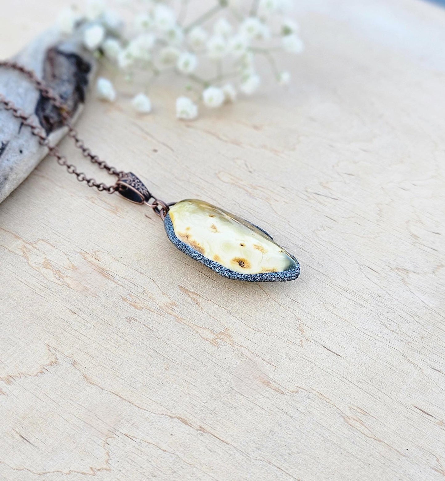 pendant with large amber, mounted in polymer clay, Copper-colored chain