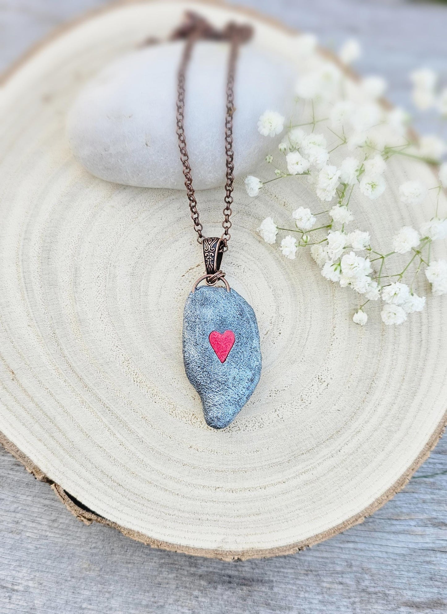 pendant with large amber, mounted in polymer clay, Copper-colored chain