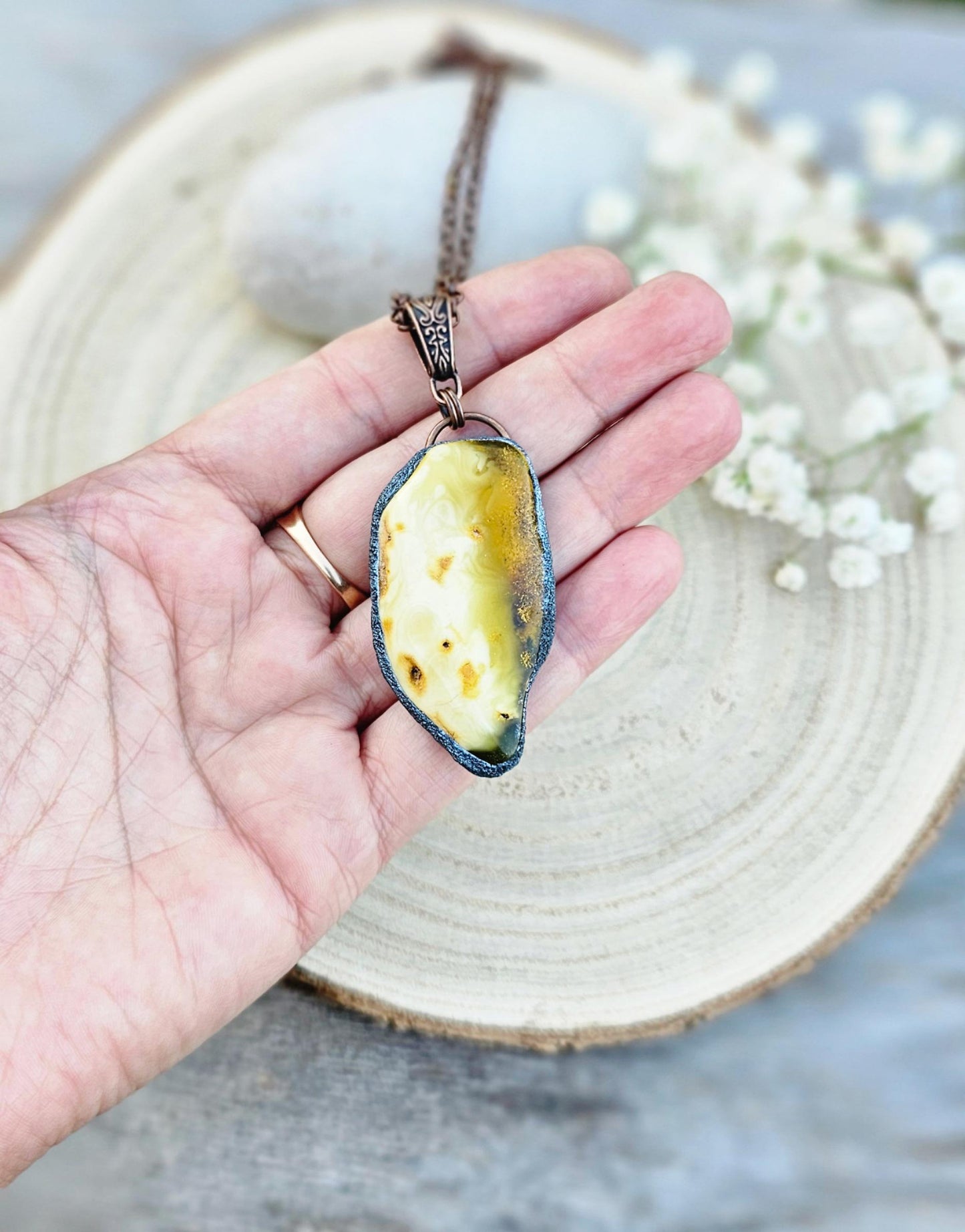 pendant with large amber, mounted in polymer clay, Copper-colored chain