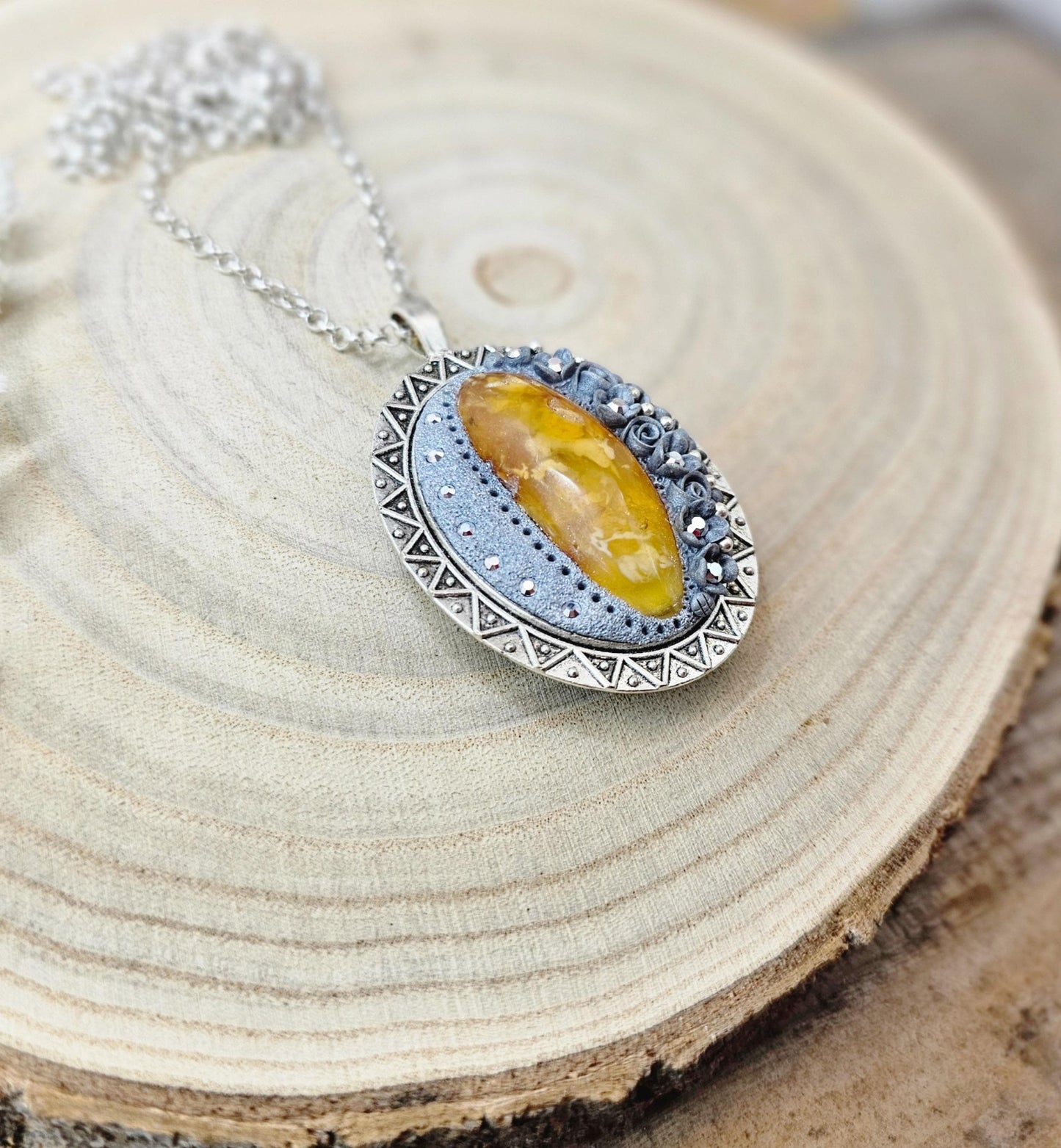 Double-sided Pendant locket with baltic amber and polymer clay flowers