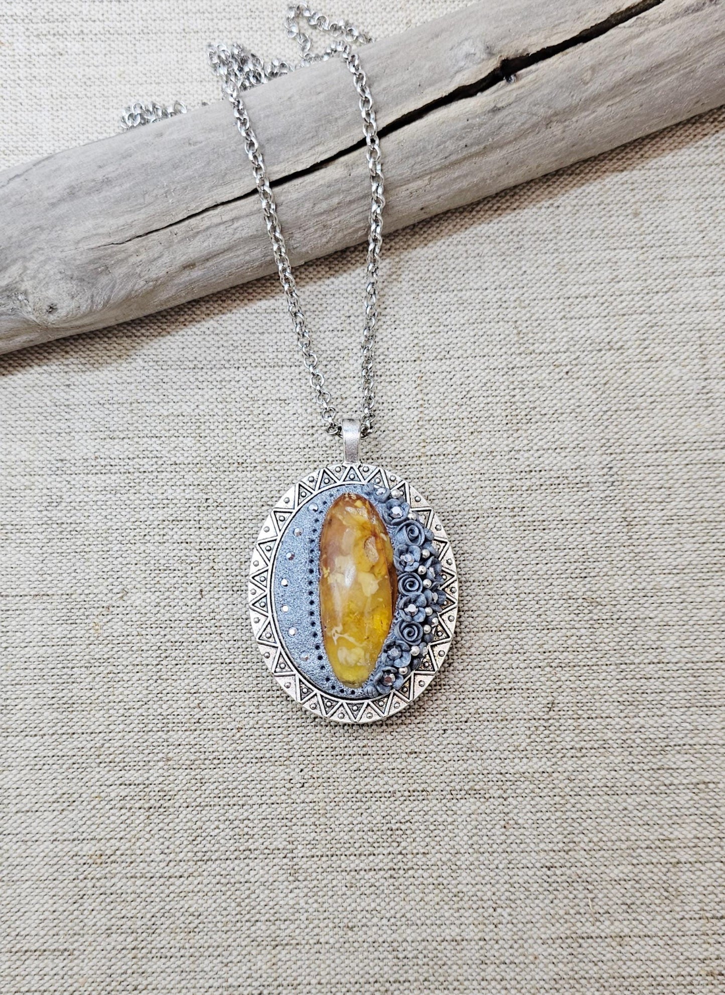 Double-sided Pendant locket with baltic amber and polymer clay flowers