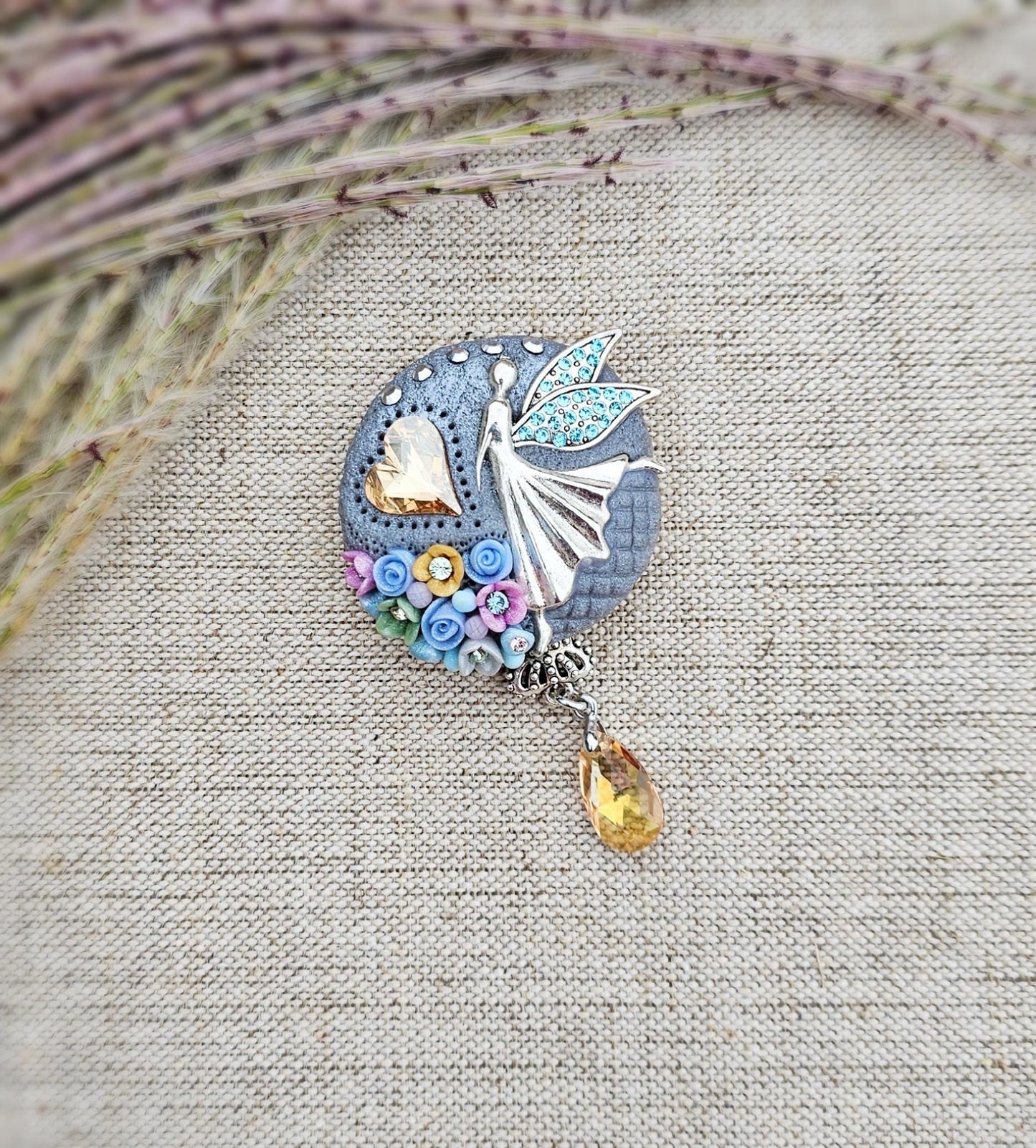 handmade polymer clay brooch with flowers, crystals and heart. Flower jewelry.