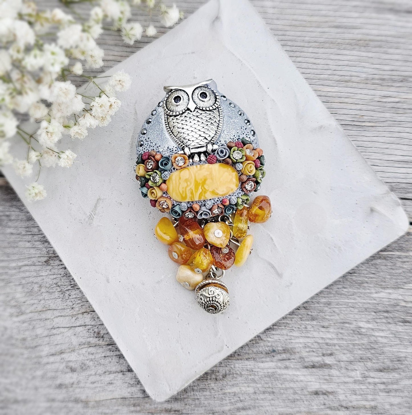 handmade polymer clay brooch with owl and handmade flowers and amber