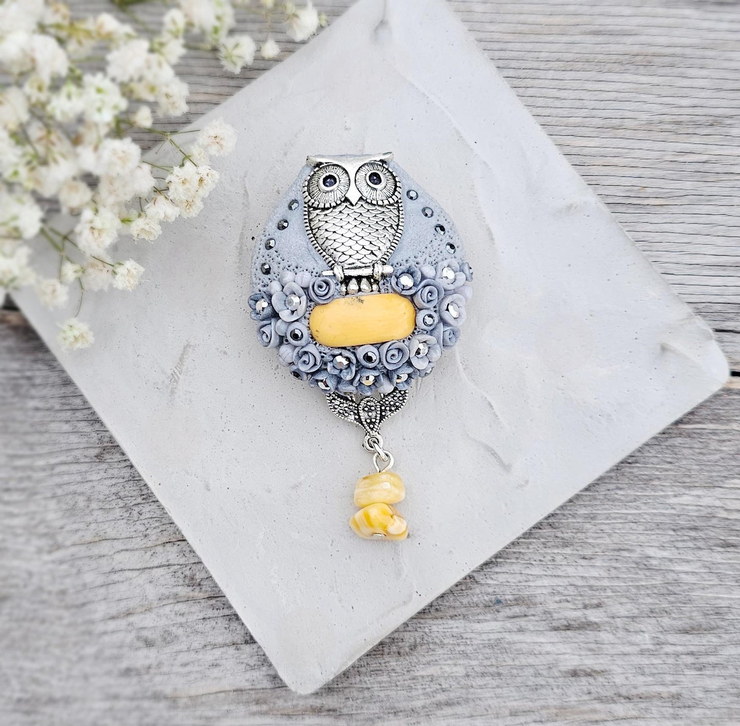 handmade polymer clay brooch with owl and handmade flowers and baltic amber