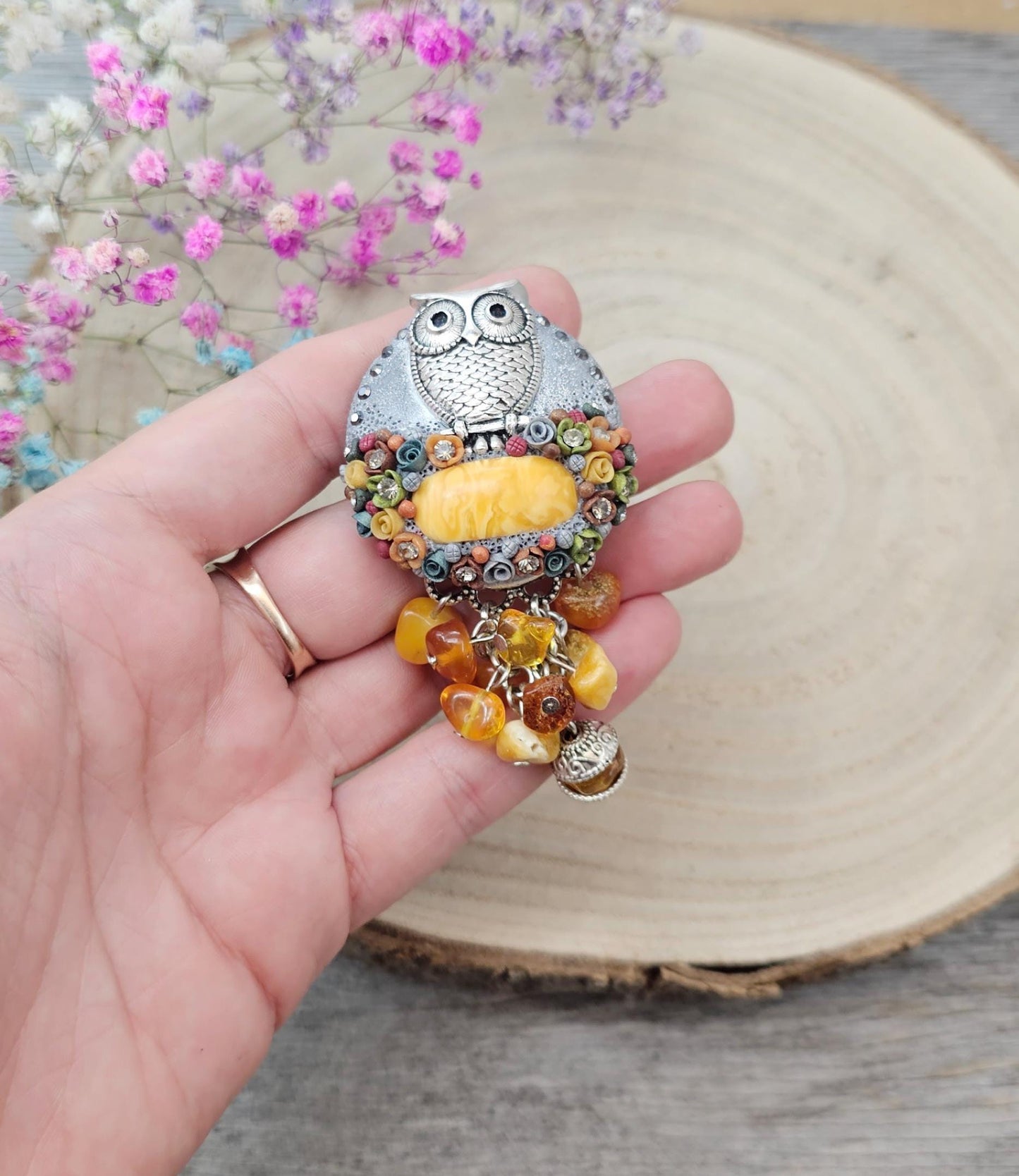 handmade polymer clay brooch with owl and handmade flowers and amber