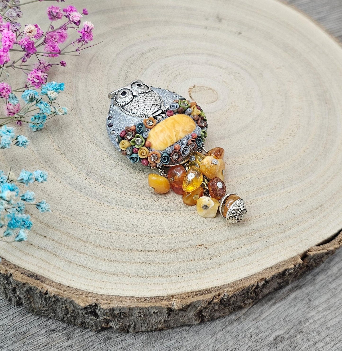 handmade polymer clay brooch with owl and handmade flowers and amber