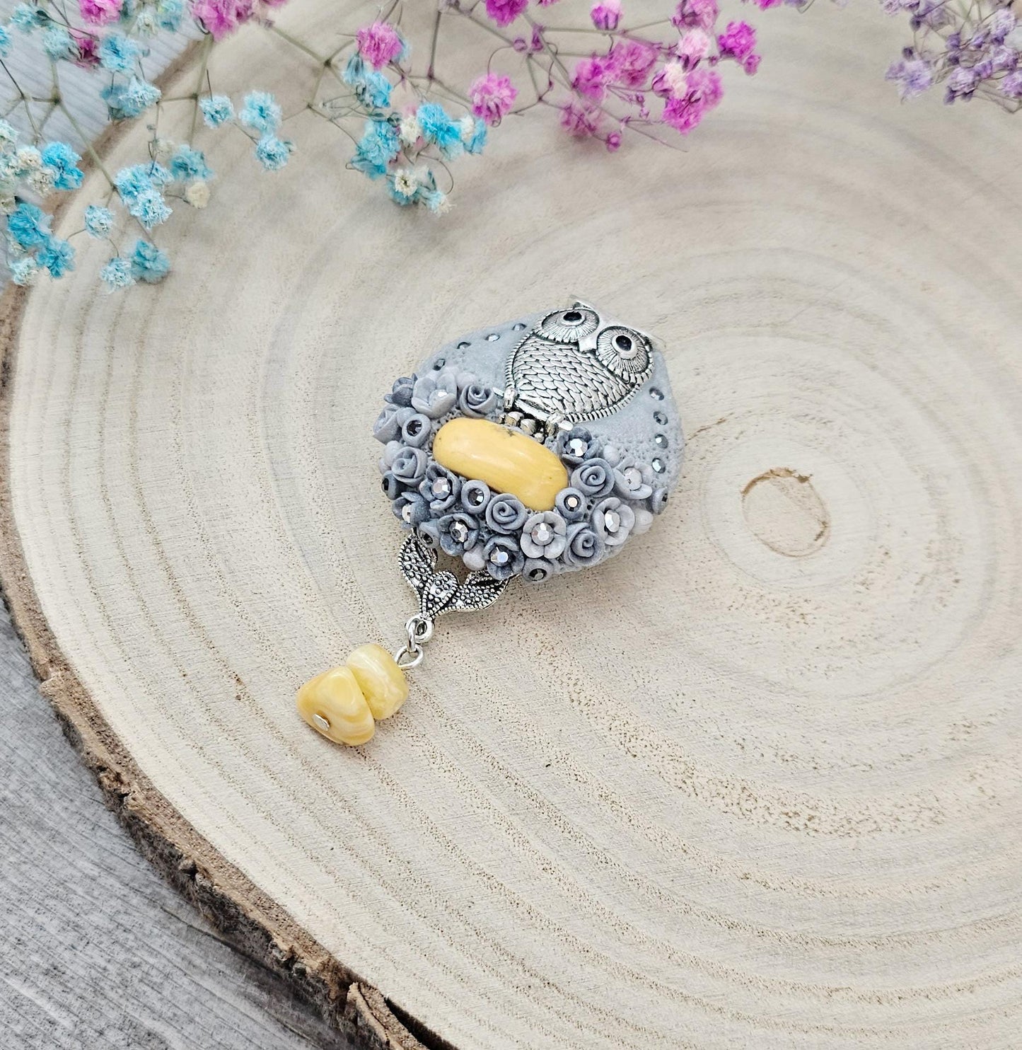 handmade polymer clay brooch with owl and handmade flowers and baltic amber