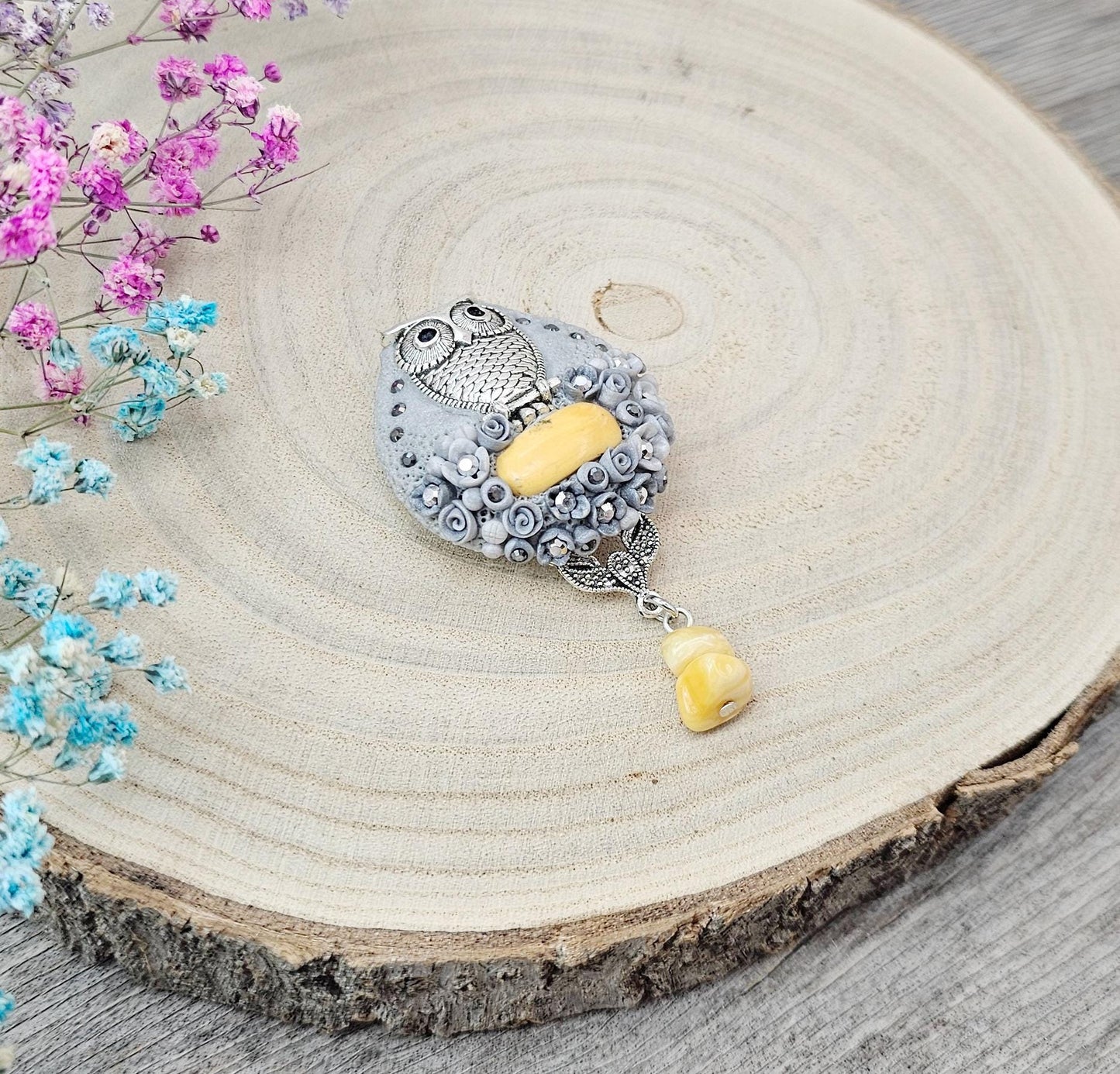 handmade polymer clay brooch with owl and handmade flowers and baltic amber