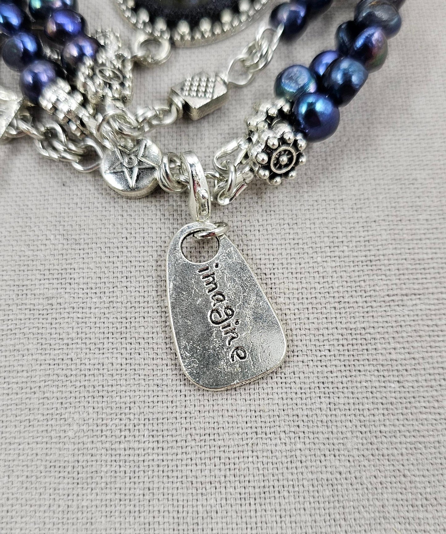 Handcrafted bracelet with labradorite and two rows of dark blue pearl beads
