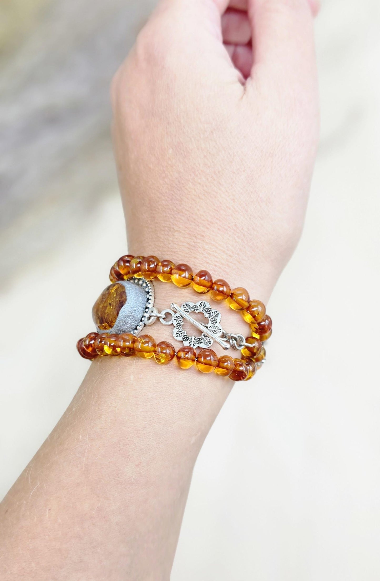 A unique bracelet with light transparent baltic amber
