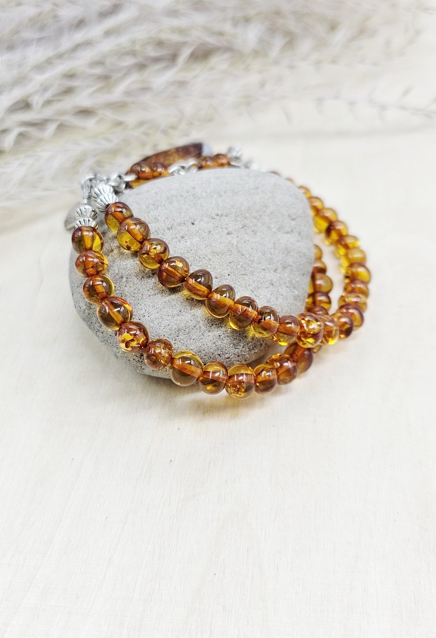 A unique bracelet with light transparent baltic amber