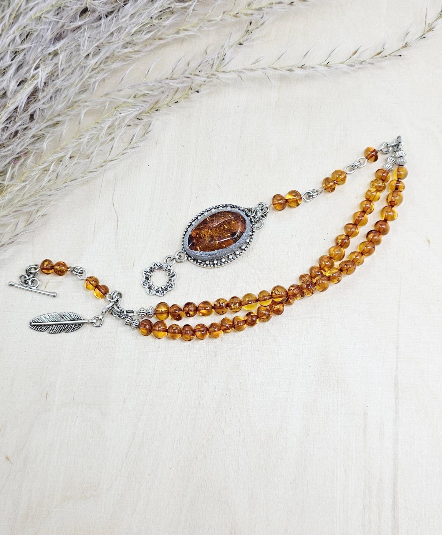 A unique bracelet with light transparent baltic amber