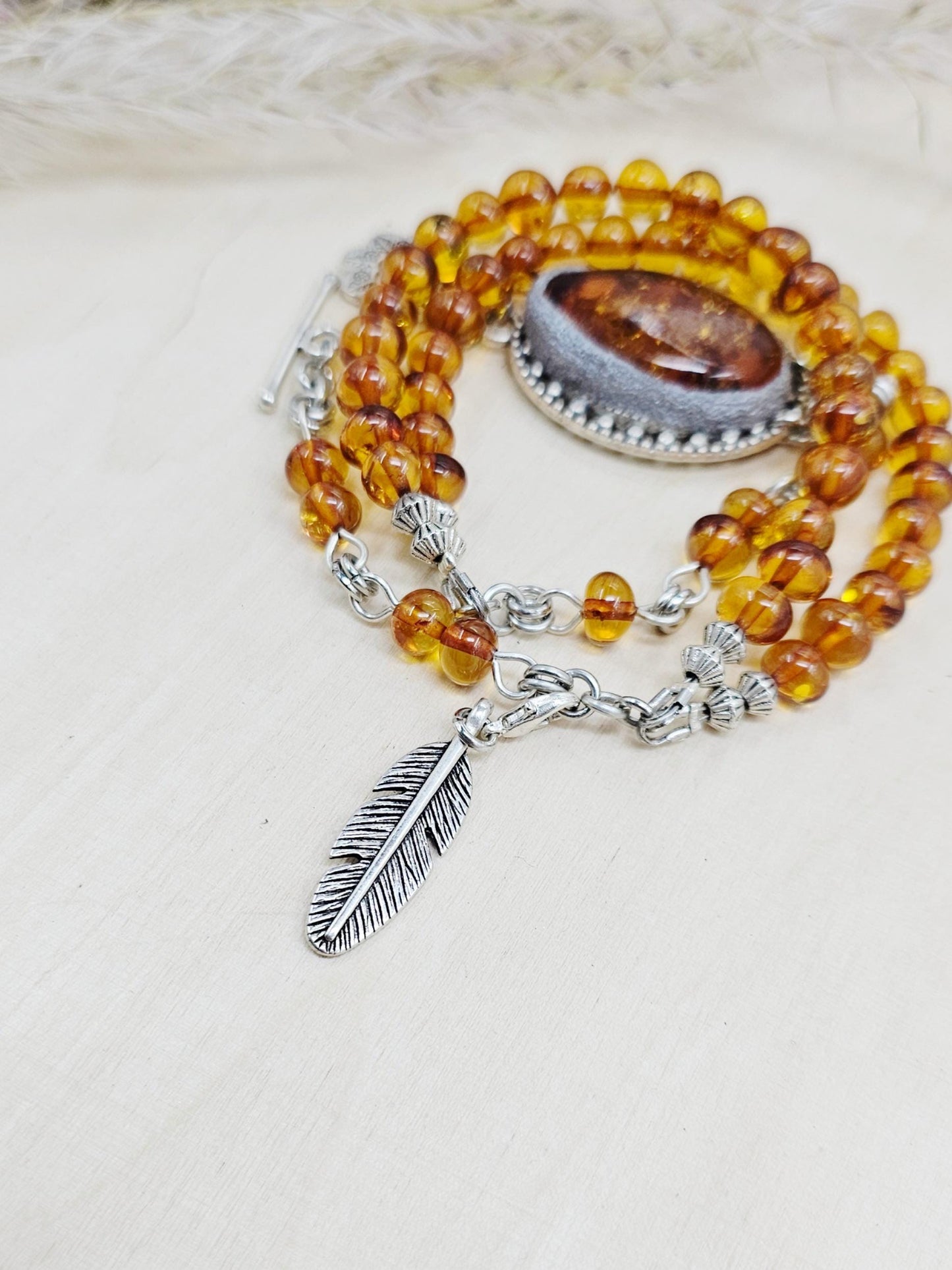 A unique bracelet with light transparent baltic amber