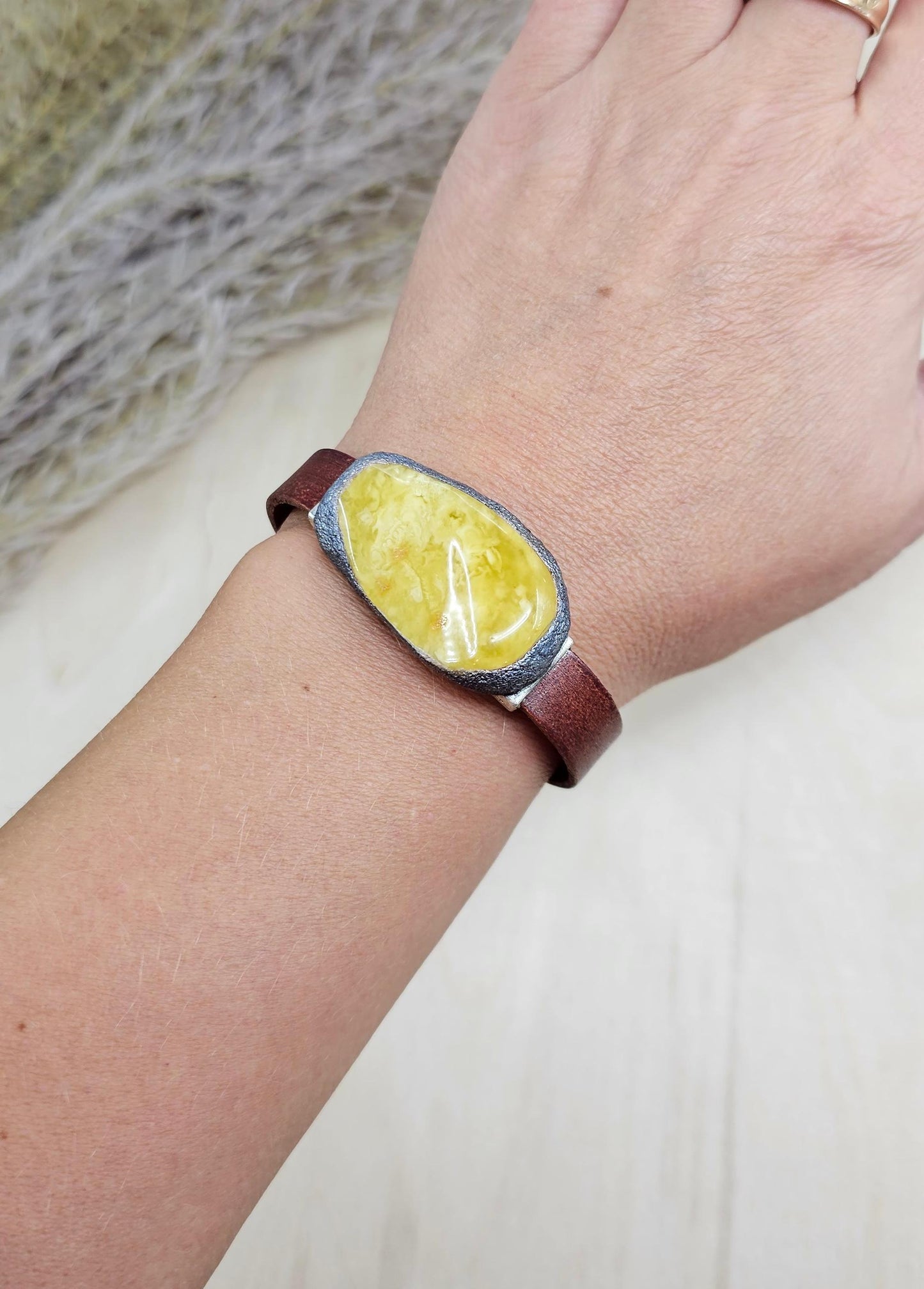 Handmade bracelet with chunky light yellow baltic amber and brown leather strap.