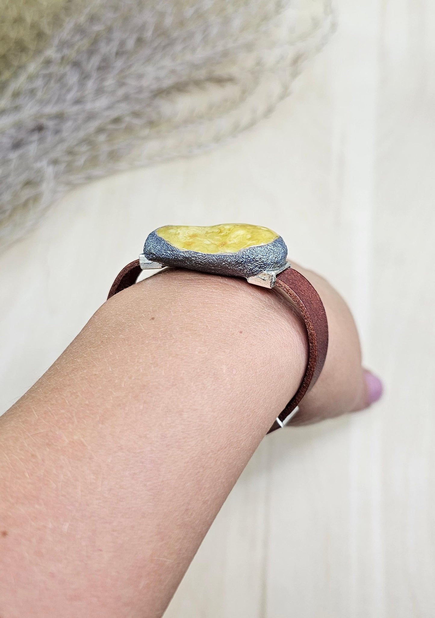 Handmade bracelet with chunky light yellow baltic amber and brown leather strap.