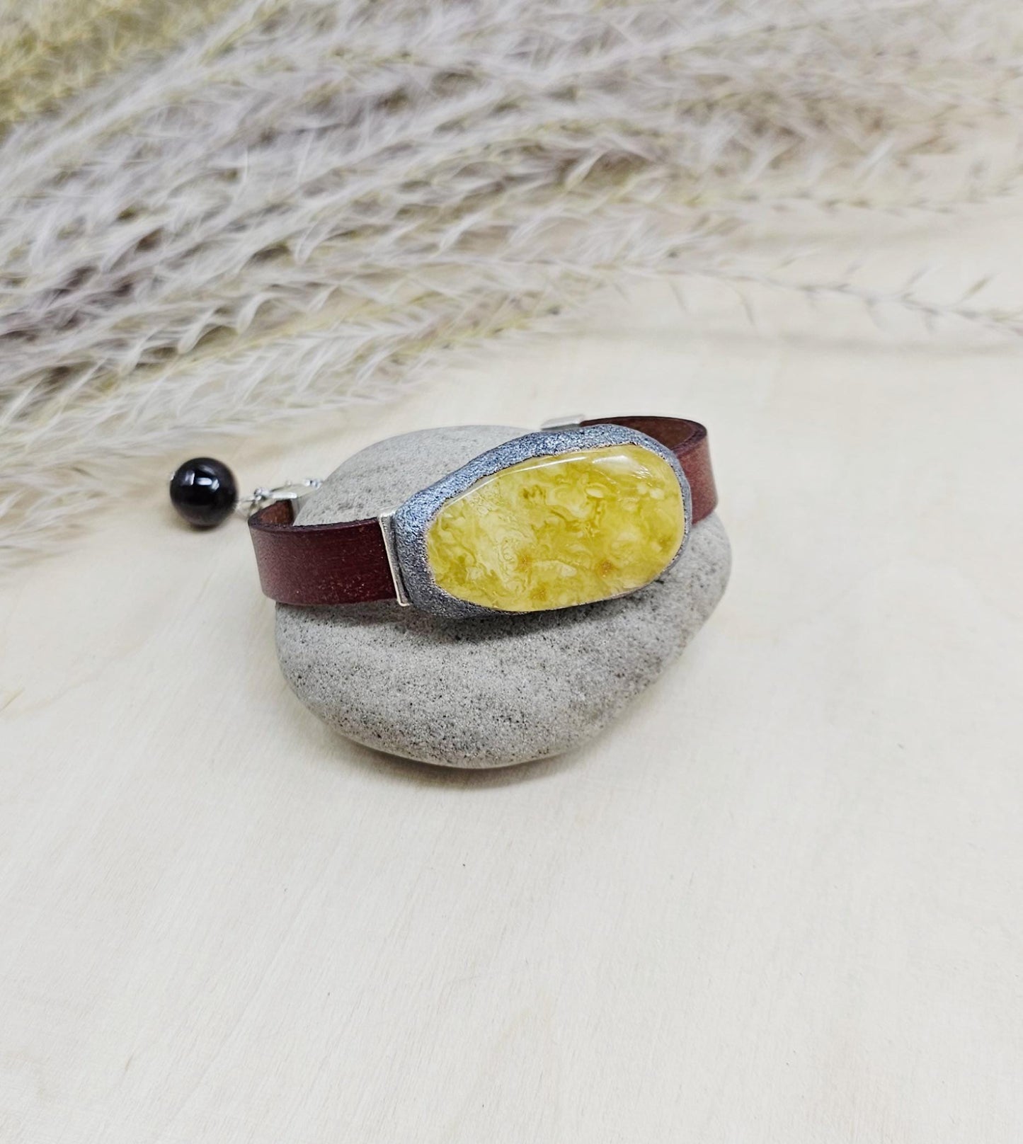 Handmade bracelet with chunky light yellow baltic amber and brown leather strap.