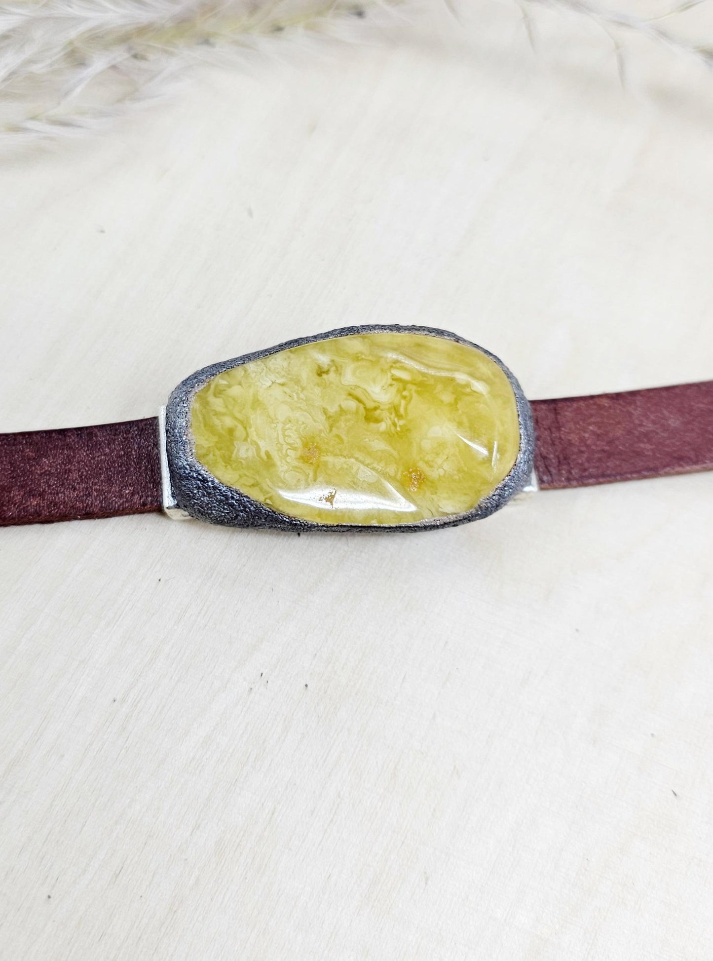 Handmade bracelet with chunky light yellow baltic amber and brown leather strap.